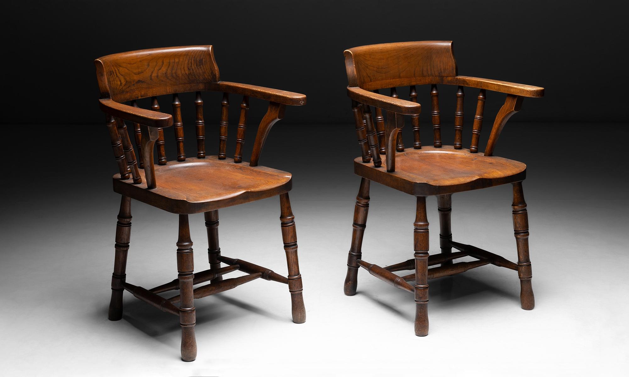 Oak Captain's chair.

England circa 1890.

Carved seat and back, turned spindles, legs, and stretchers.

Measures: 22.5”L x 19”D x 34”H x 19.5”seat.