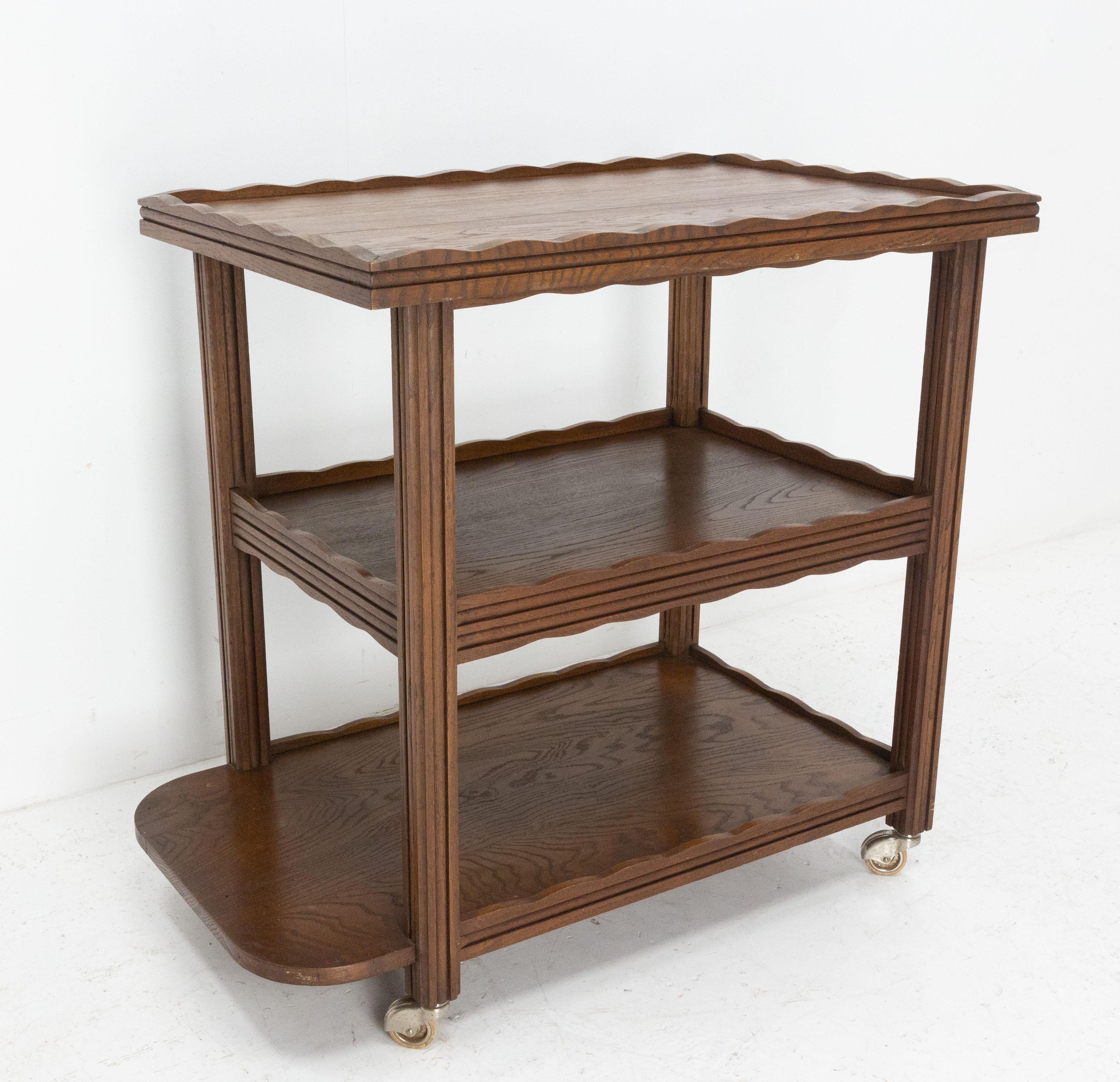 Bar cart drinks or cocktail trolley
Interior dimension of the first tray: L: 29.53 in. x 9.84 in. (75 x 45 cm)
Massive oak
On wheels
French, circa 1940
Good vintage condition.

Shipping:
L 83,5 P53 H80,5 24,3 KG.
 