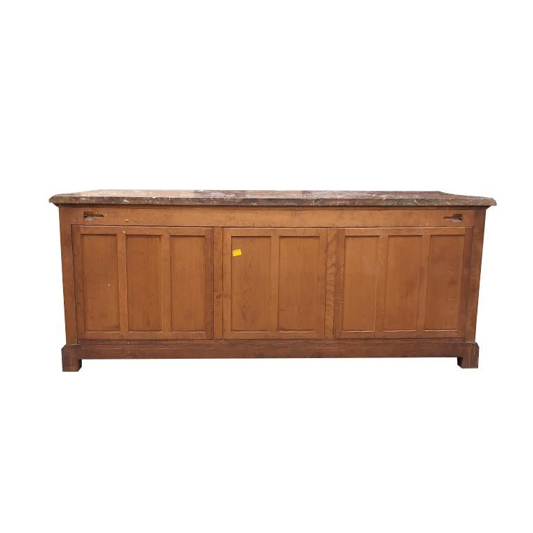 Important richly decorated hand-carved 18th-century traditional French Provincial oak cabinet, credenza, sideboard, server, cupboard, enfilade or buffet of generous proportions.  Often referred during this time period as meubles or “movables”. The