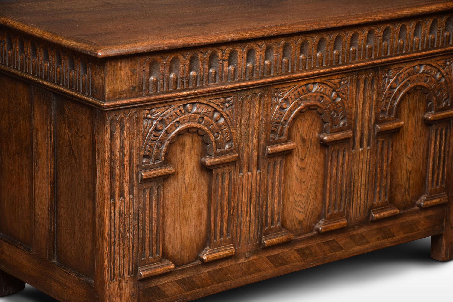 Oak coffer or blanket chest, the large rectangular hinged lid opening to reveal large storage facility. Above an arcaded frieze and three arched panels. All raised up on stile feet.
Dimensions:
Height 24.5 inches
Width 42 inches
Depth 18 inches.