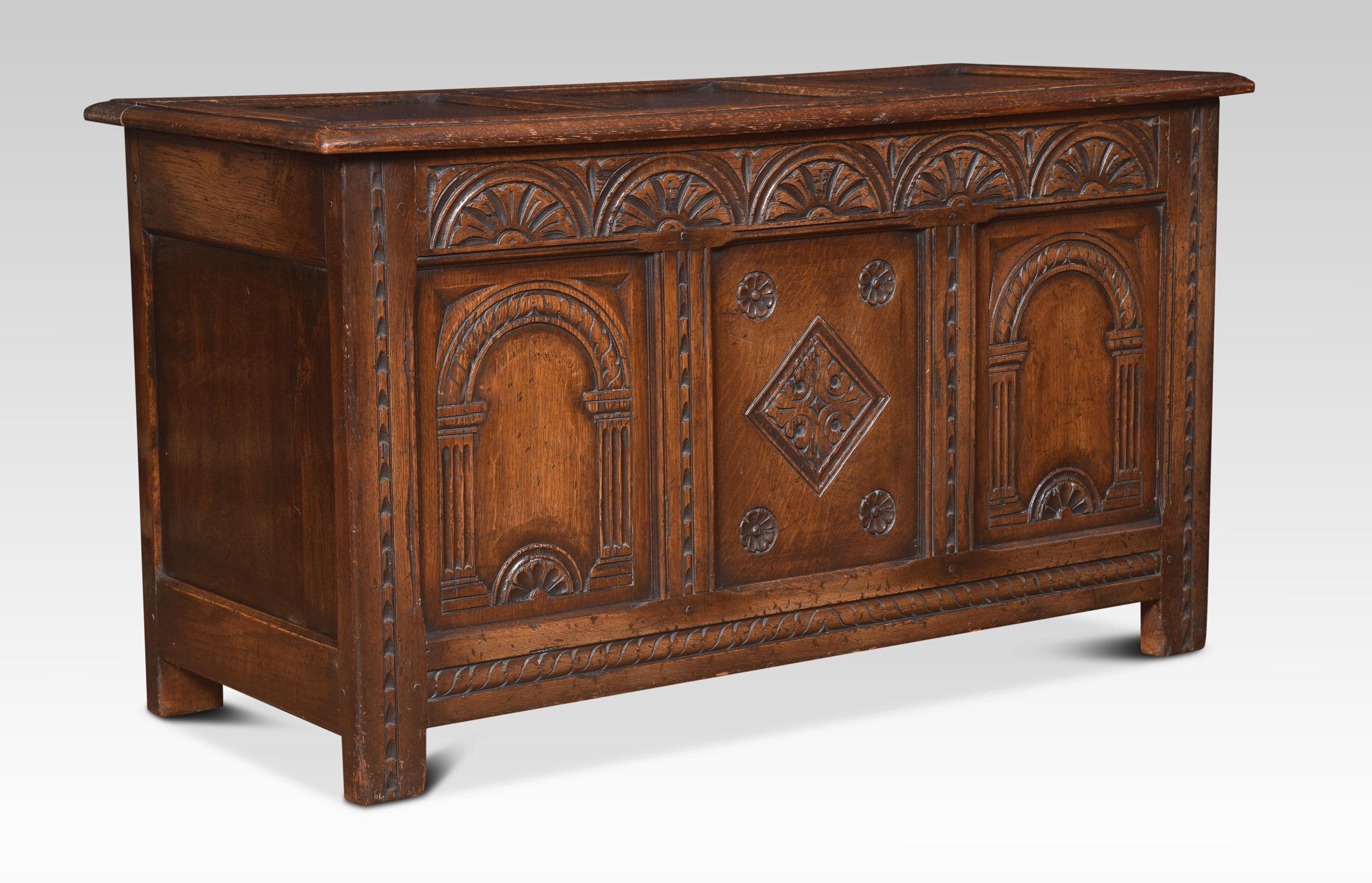 Oak coffer or blanket chest, the large rectangular hinged lid opening to reveal Lage storage facility. Above an arcaded frieze and three carved panels. All raised up on stile feet.
Dimensions
Height 23 inches
Width 41.5 inches
Depth 17.5 inches.