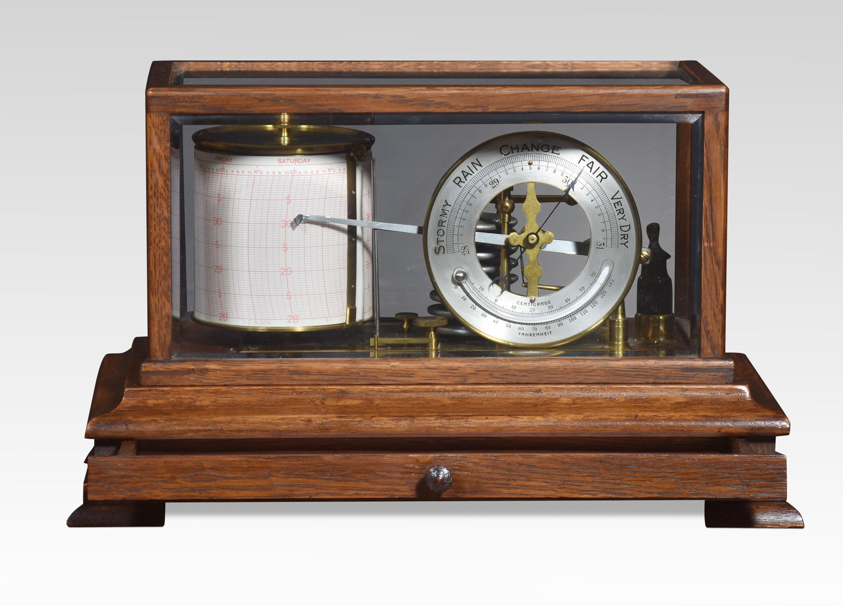Oak-cased barograph and barometer retailed by Harrods London, having five bevelled glass panelled removable lid, and a drawer below to house the charts. The mechanical eight-day movement is housed in the drum, fitted with a seven-day chart which