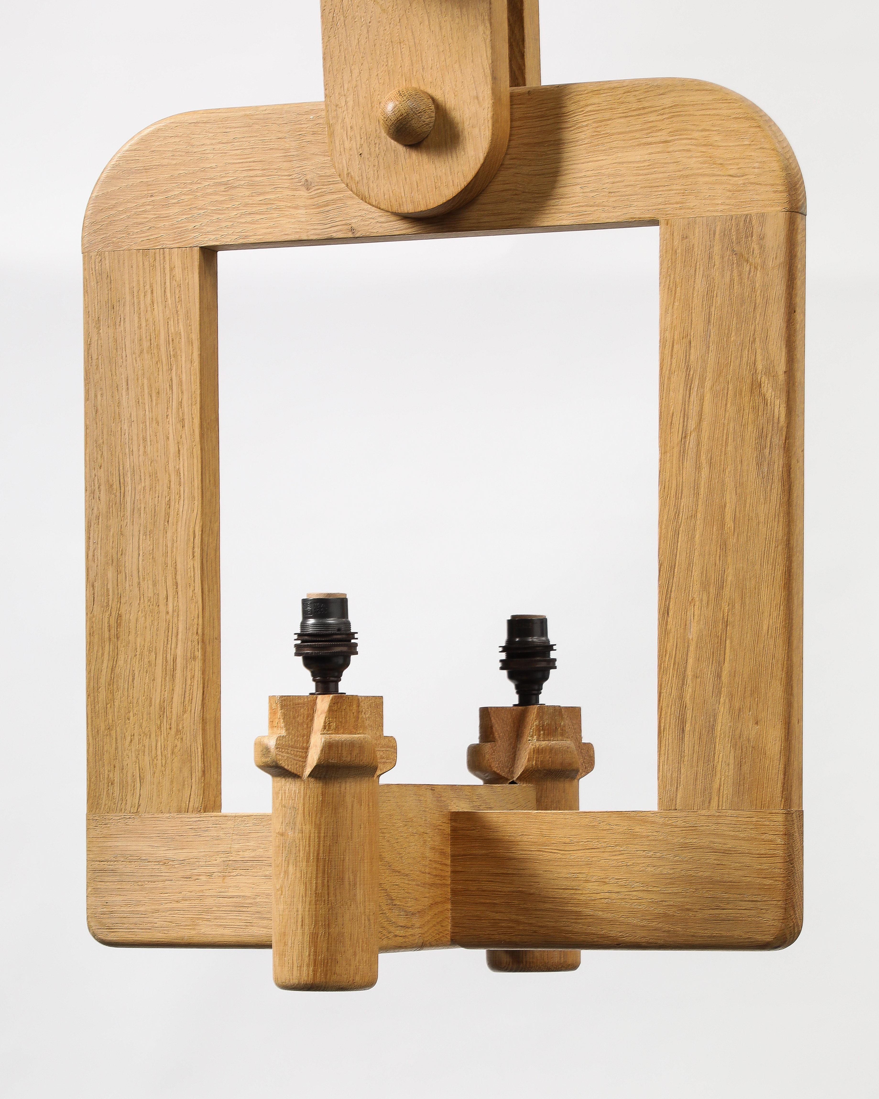 Priced individually; two available in different wood tones.

Unique wooden chandelier by Guillerme and Chambron.