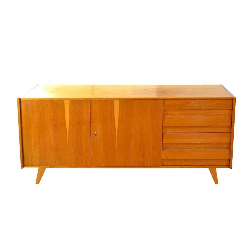 This oak plywood chest of drawers was manufactured by Interiér Praha in Czechoslovakia in the 1960s, and was designed by Jirí Jiroutek. After complete renovation of surface and construction as well. Drawers are inside made of plastic.