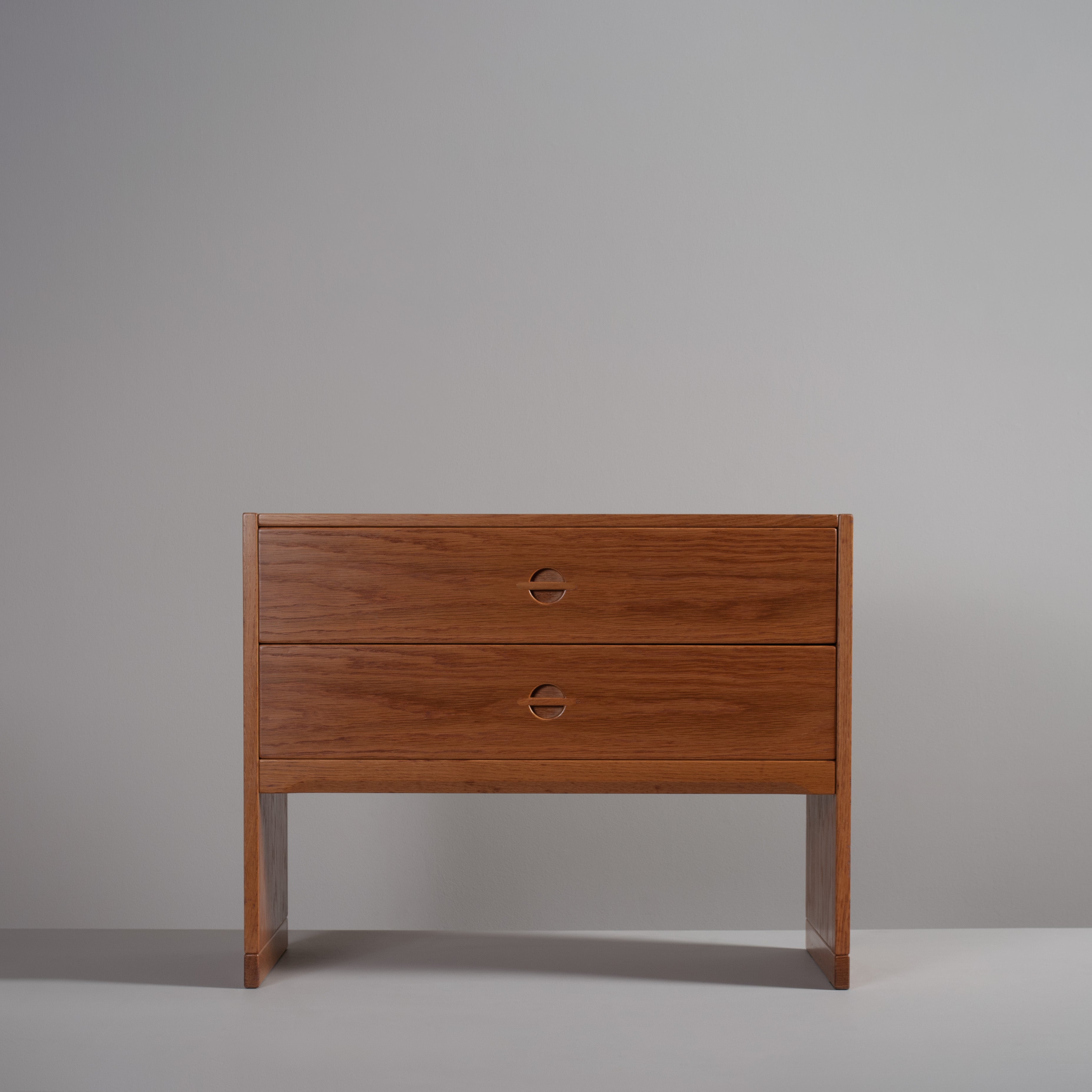 A rarely seen chest (model 693) by Kai Kristiansen - Aksel Kjersgaard, Denmark, circa 1960's. Constructed from oak with some beech internal parts. Lovely design and build by Kjersgaard. 
Would be suitable for various uses - media, bedside, night