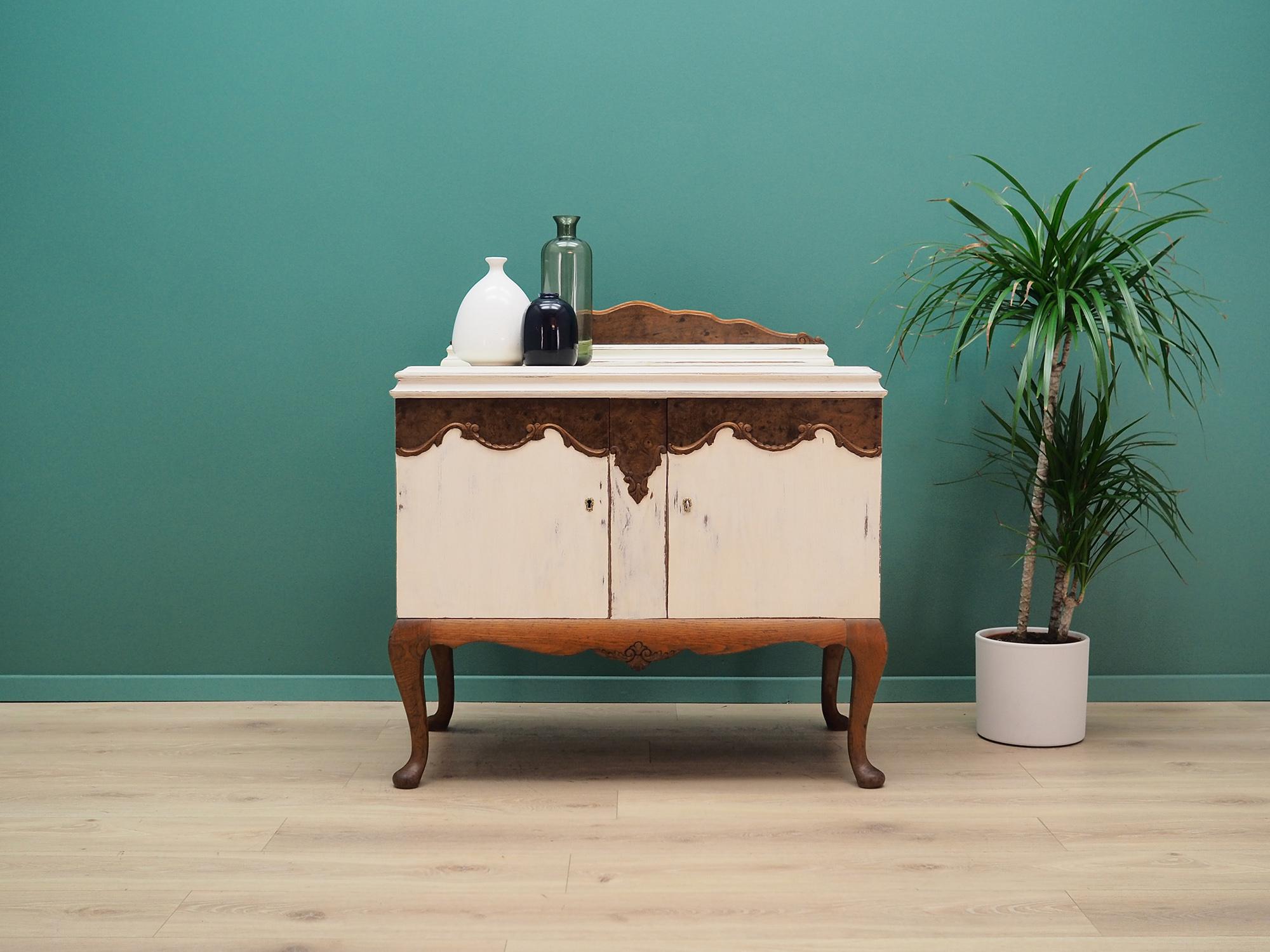 Dresser was made in the 1950s. Swedish production.

The construction is made of oakwood. Legs are made of solid oakwood. Surface finished with shabby chic method. Inside the space was filled with practical shelf. The chest of drawers with a