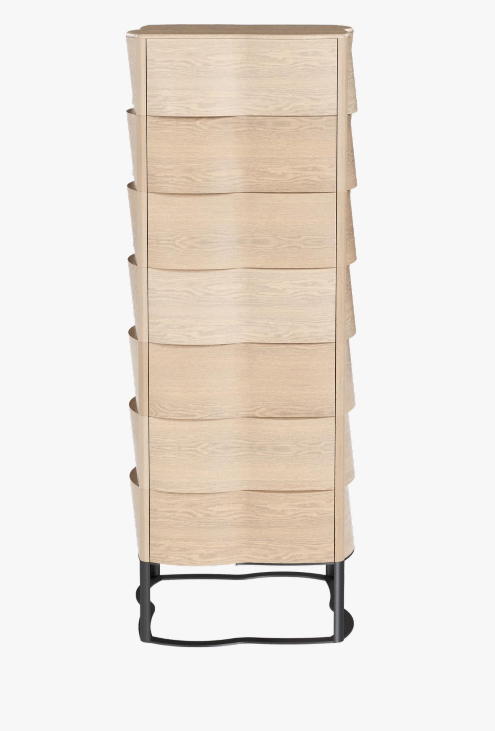 Stunning Sculptural Design creation Oak chest of drawers with a round shaped silhouette that reveals the wood flexibility and beauty and wakens the desire of feeling its shape by touch.
It stands out for the elegance with which the combination of