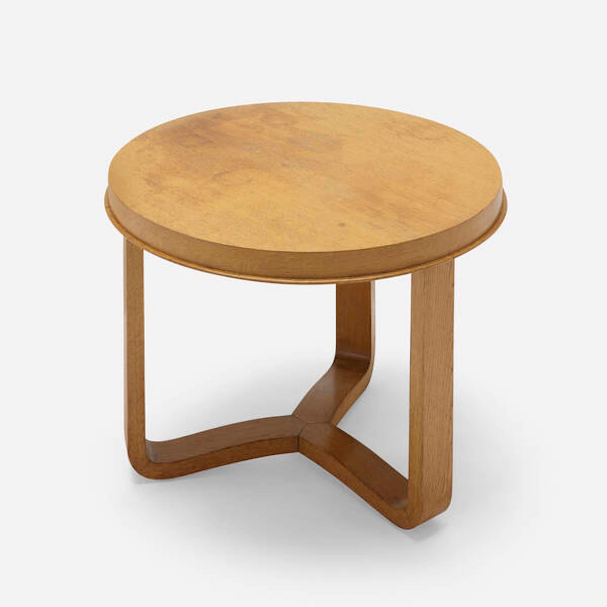 Oak circular side table the manner of Jacques Adnet.