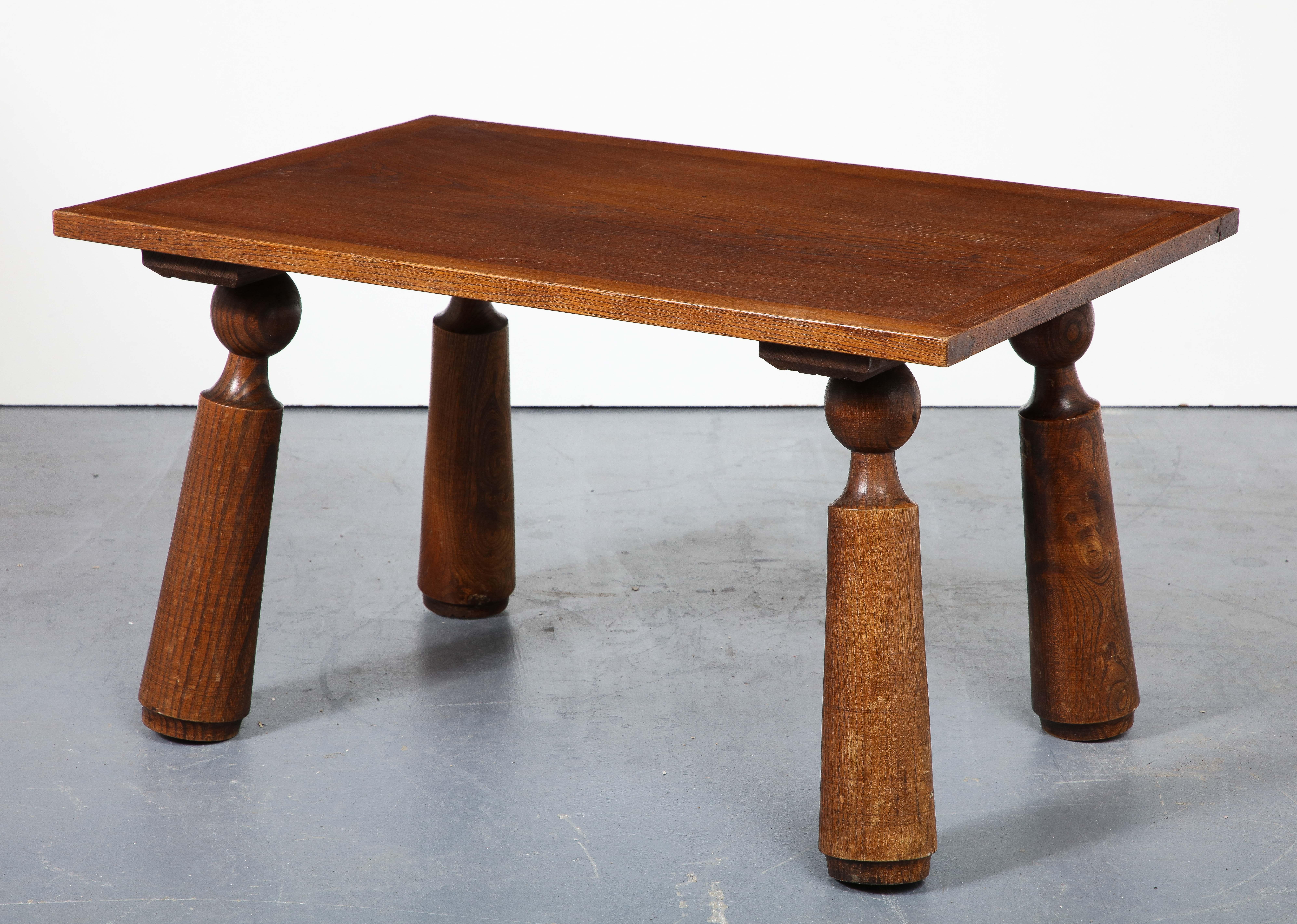 Solid oak coffee table with distinctive, hand-turned legs; beautifully patinated.
