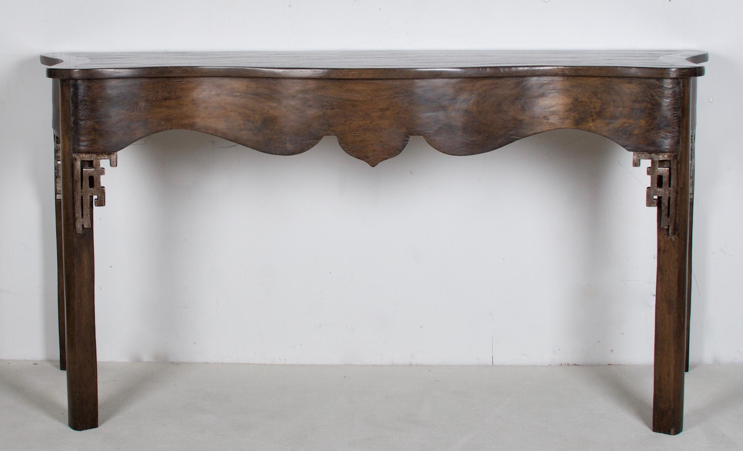 A lovely oak console by a famous interior design showroom.
The console has some oriental design aspects as well as a
serpentine scalloped front. Very beautiful handcrafted piece with
a modern finish.