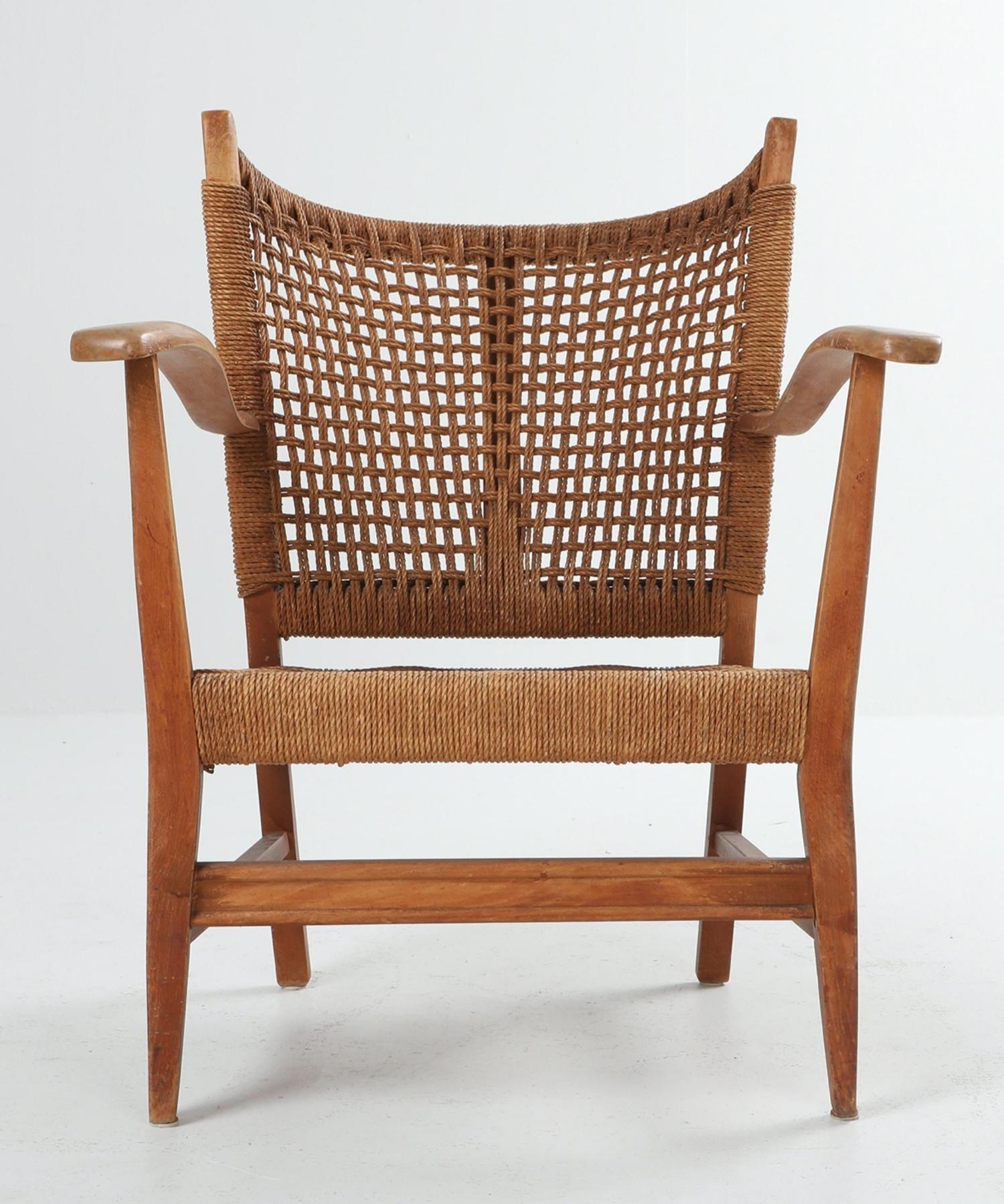 Dynamic form, oak frame with cord seat and back.

  
