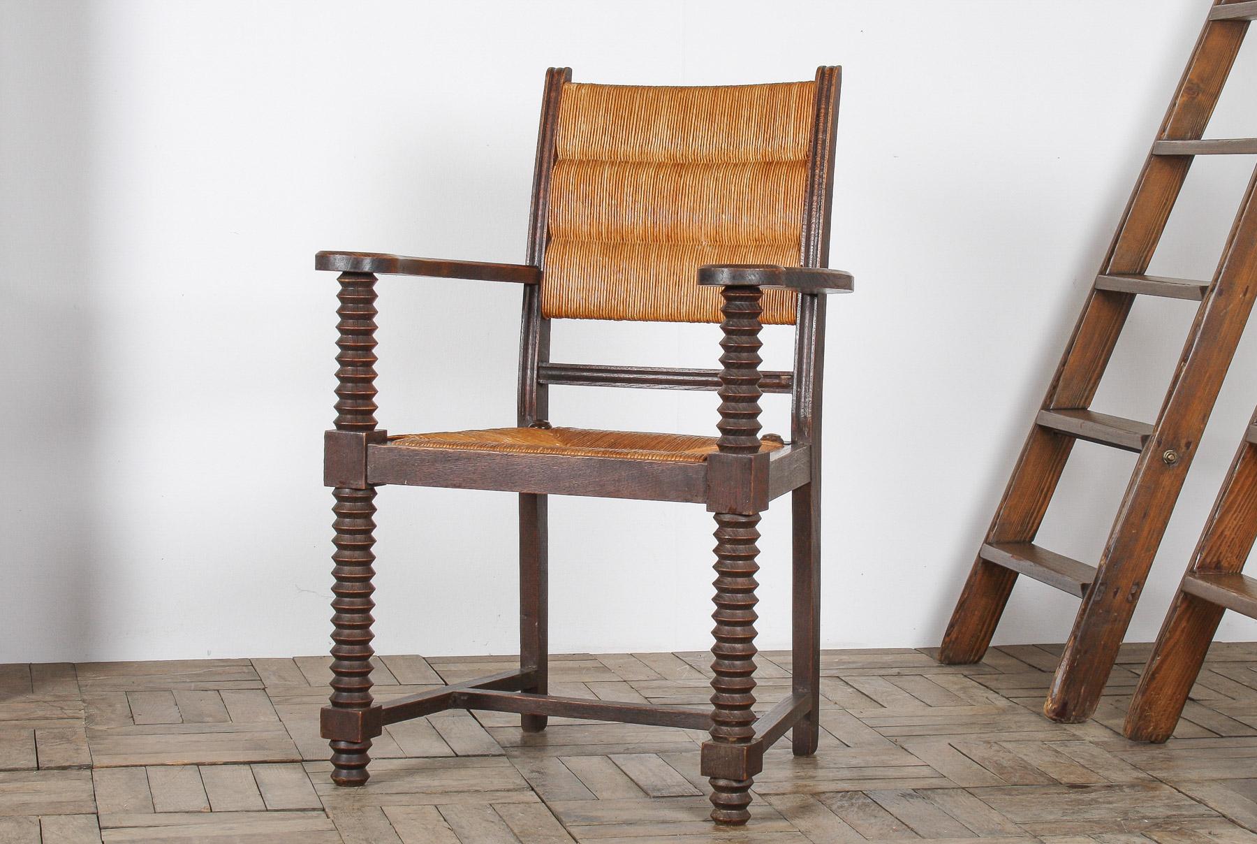 Giunco Poltrona cavatappi in Oak del 1950 con seduta in paglia attribuita a Charles Dudouyt in vendita