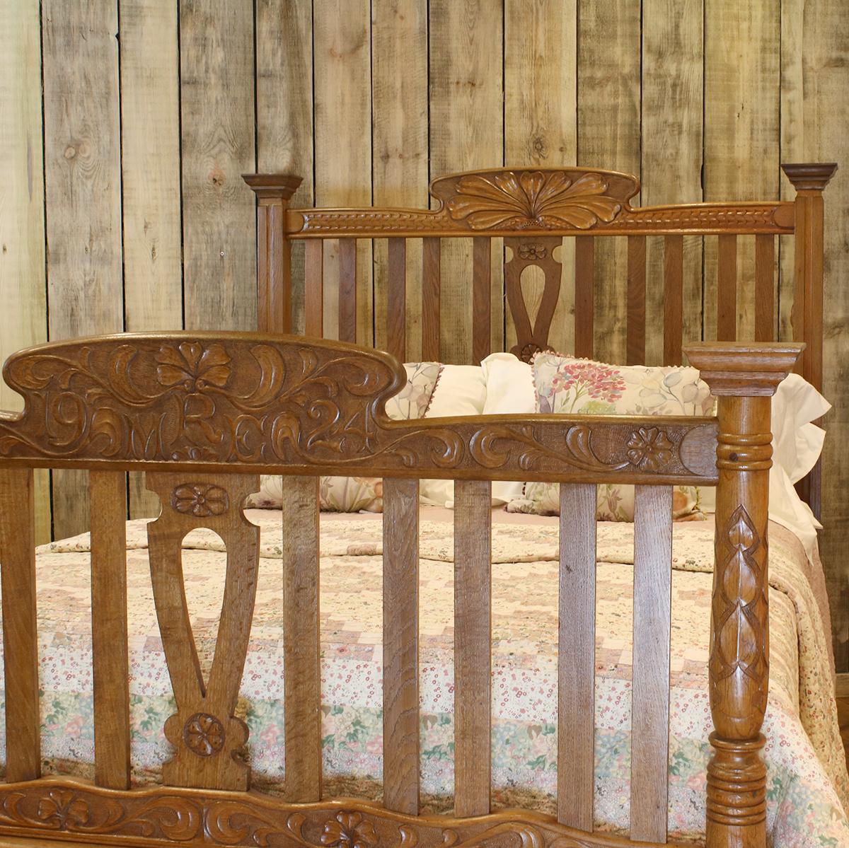 A light oak country style bed with carved posts and pediments. 

This bed accepts a double size (54 inches wide) base and mattress set.

The price is for the bed frames alone. The bases, mattresses, bedding and bed linen are extra.