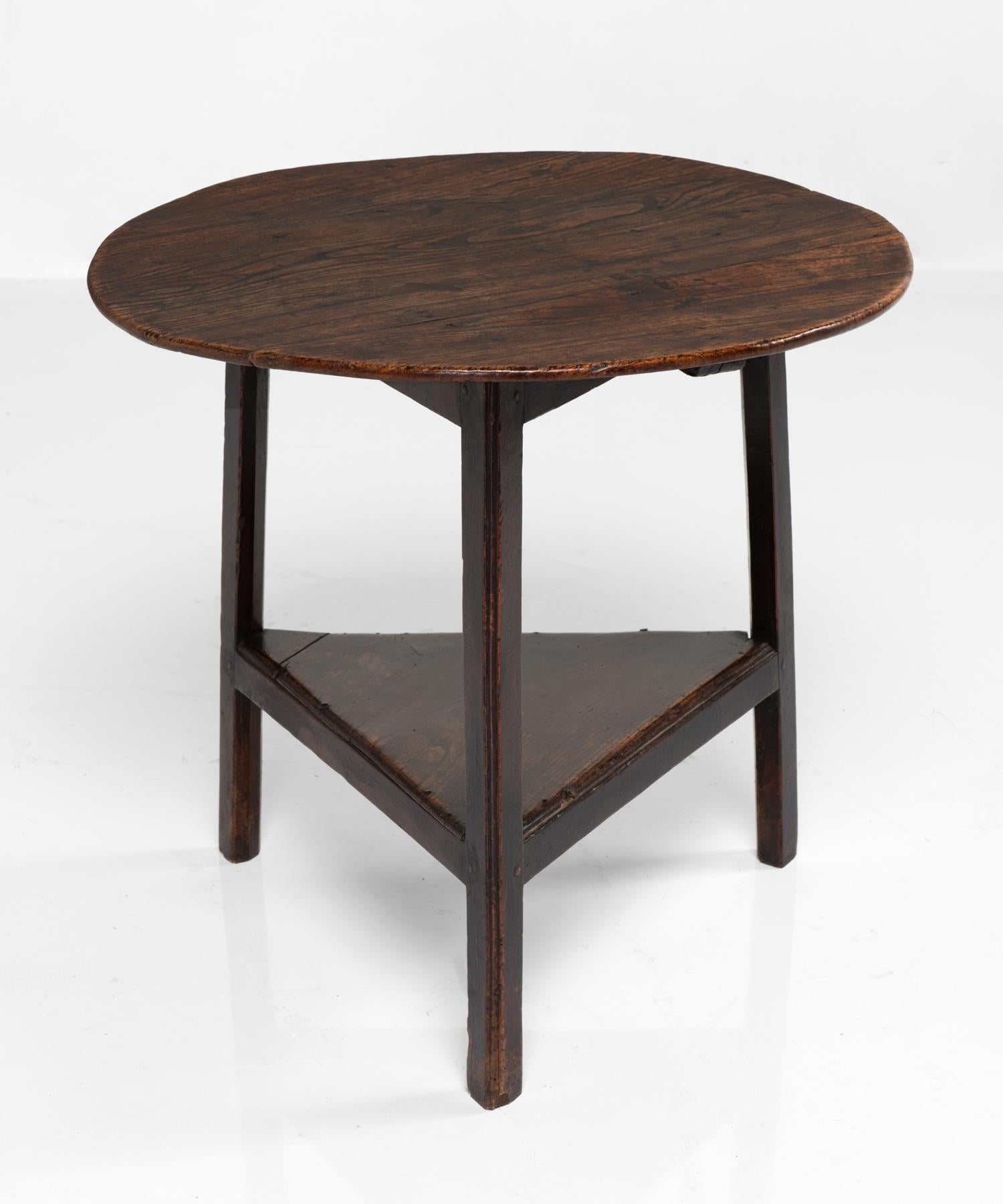 Oak cricket table, England, circa 1750.

Handsome form with low shelf and beautiful patina.