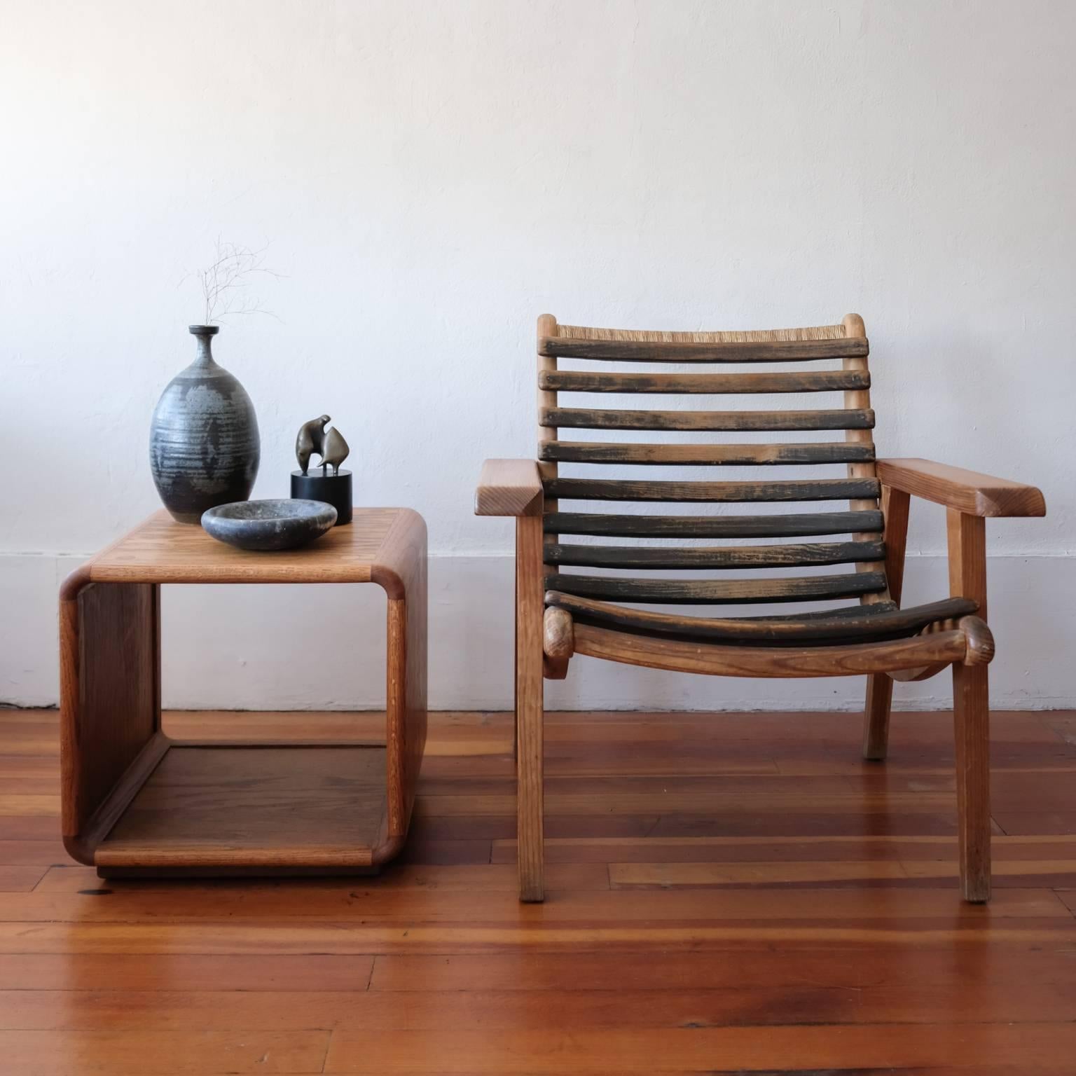 A pair of oak cube side tables. Rounded corners with nice circular joinery details. Floating base.