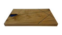 Oak cutting board with blue fine expocide resin lines