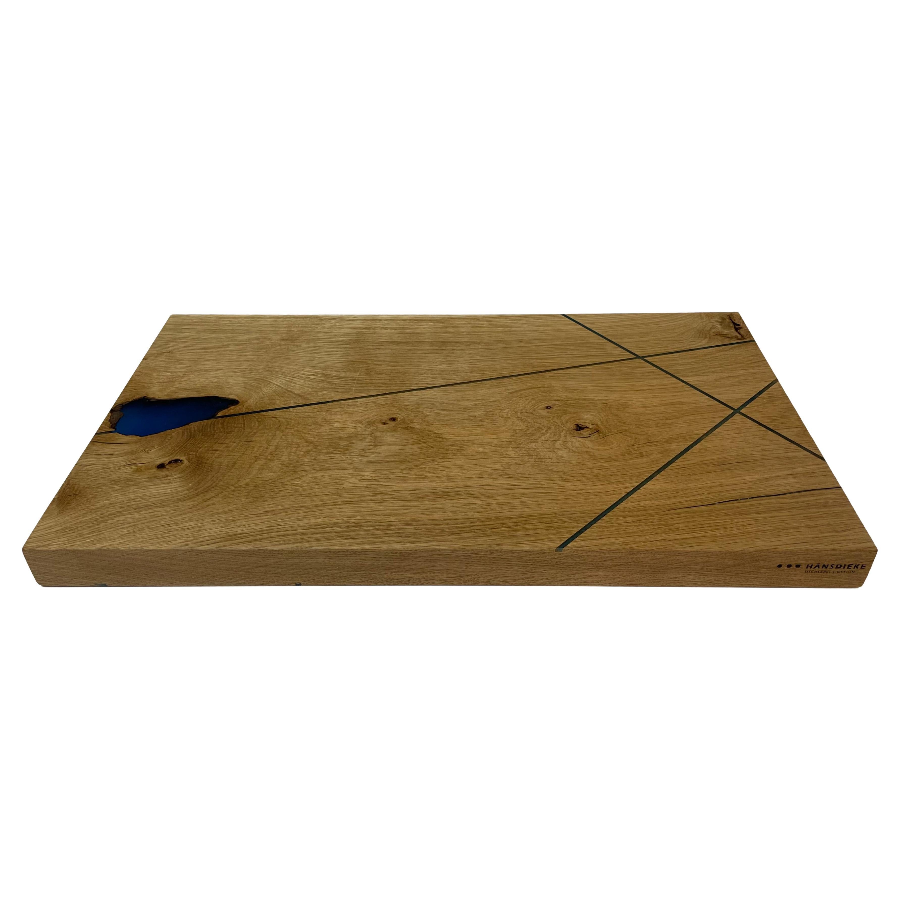 Oak cutting board with blue fine expocide resin lines For Sale