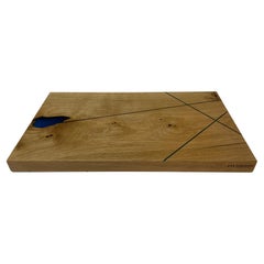 Oak cutting board with blue fine expocide resin lines