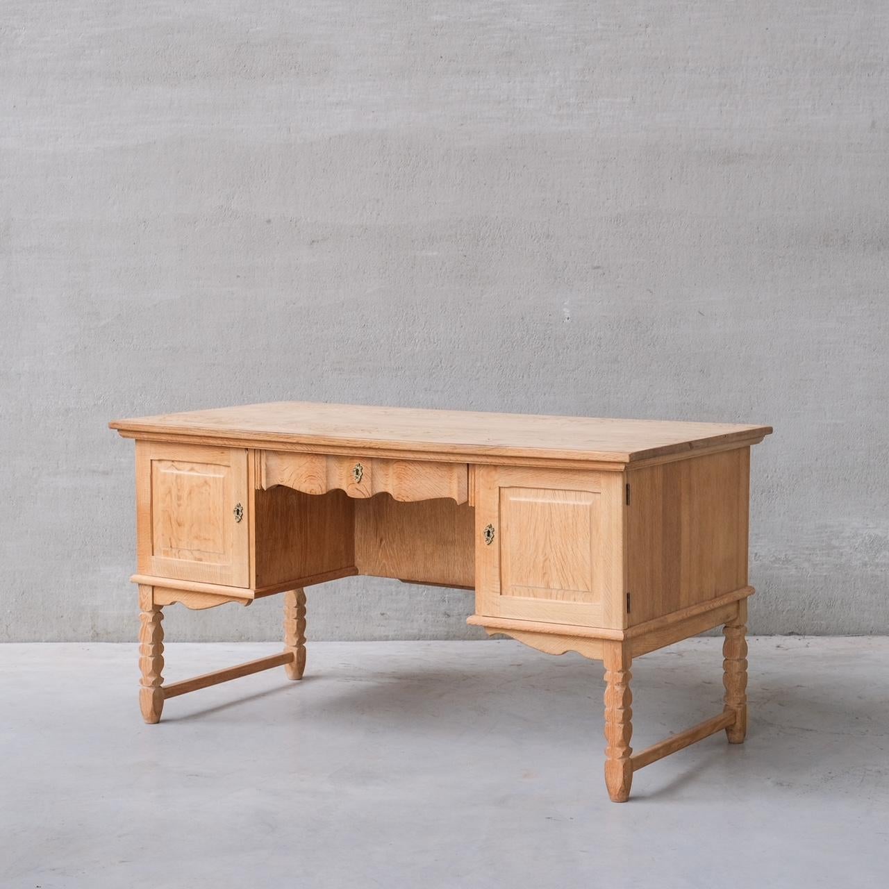 A good looking simple desk, in oak, with reverse book case shelves for displaying books or curios.

Denmark, c1960s.

Attributed to Henning Kjaernulf.

Good vintage condition. Some scuffs and patina commensurate with age.

Internal ref: