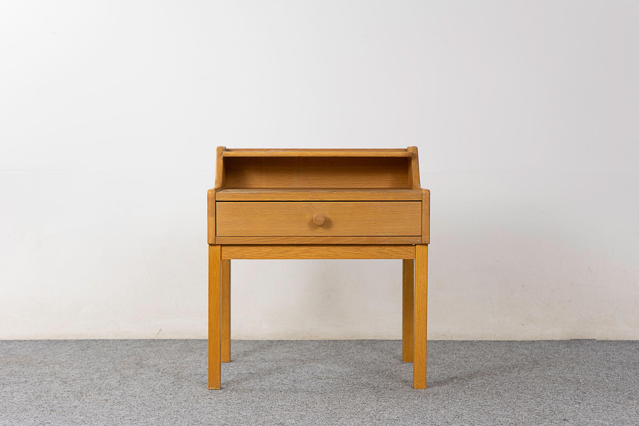 Oak mid-century bedside, circa 1960's. Nice compact size with a sleek drawer.