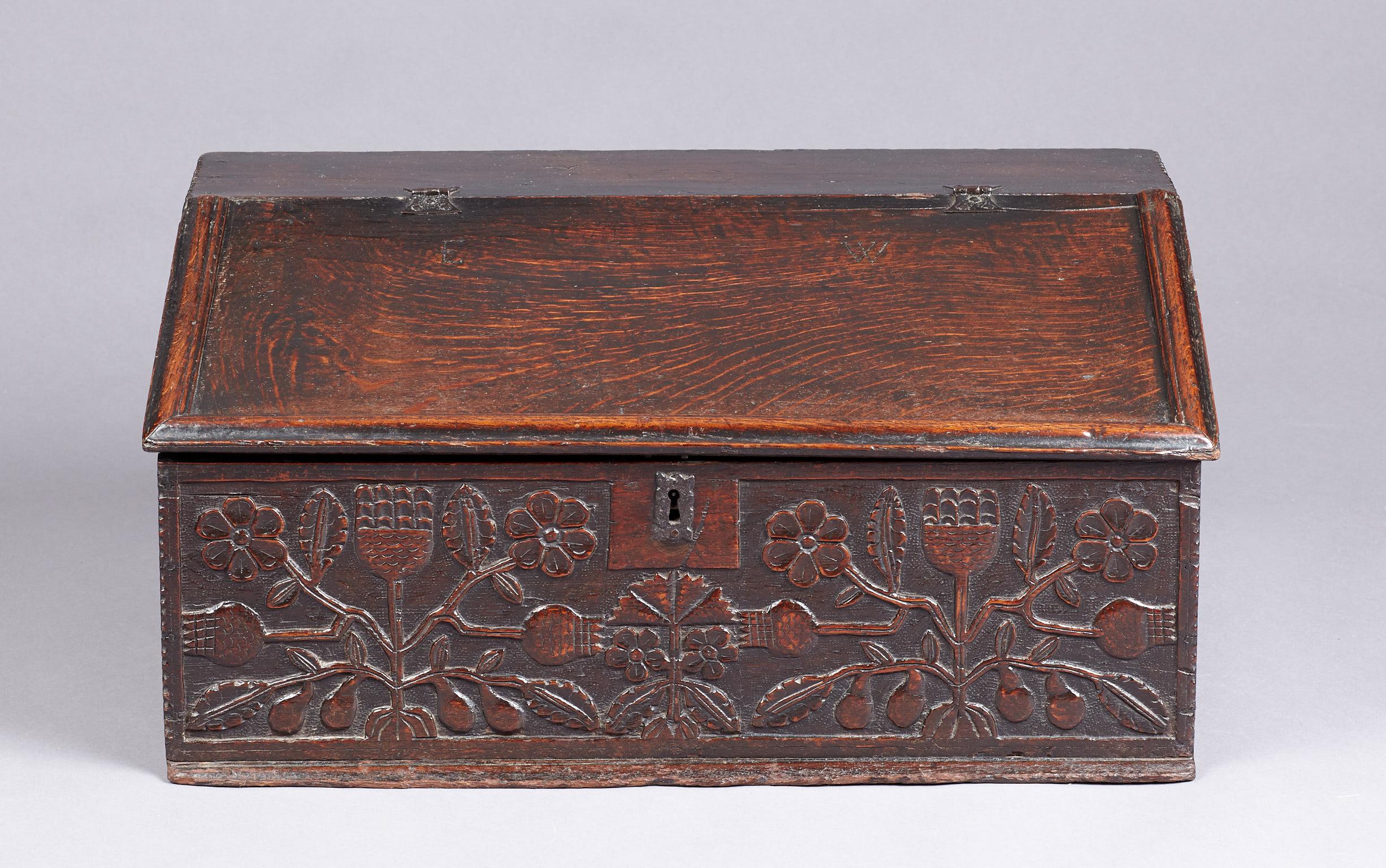 Mid-17th century oak desk box, Lancashire, circa 1660-1670.

The sloped lidded box with bold applied moldings to the top, with inscribed initials 