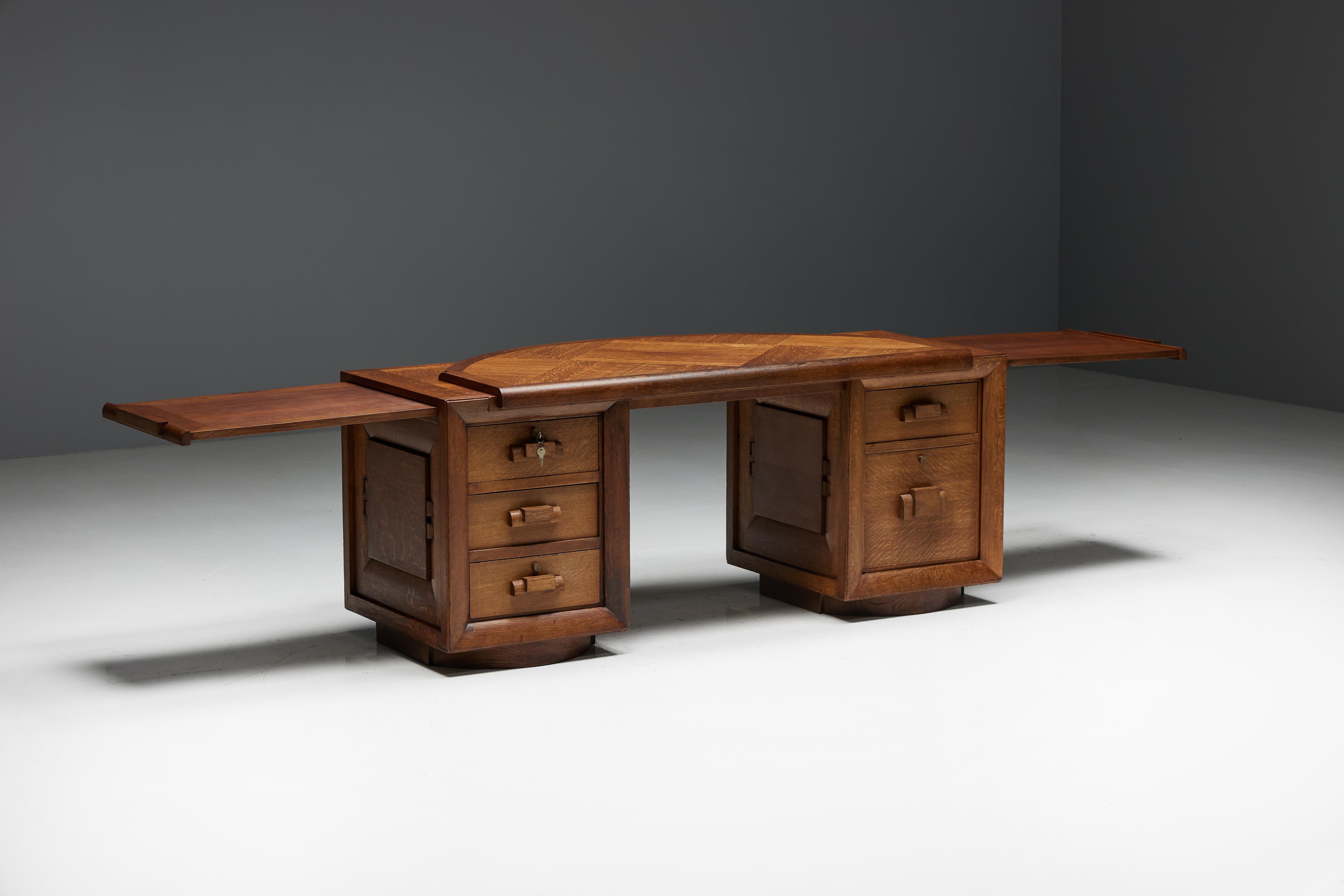 Charles Dudouyt oak desk with double base, made in the 1940s in France. The sturdy oak construction, adorned with front panels and a raised round inlaid top with a captivating parquet design, adds a touch of classic charm to your office or study.