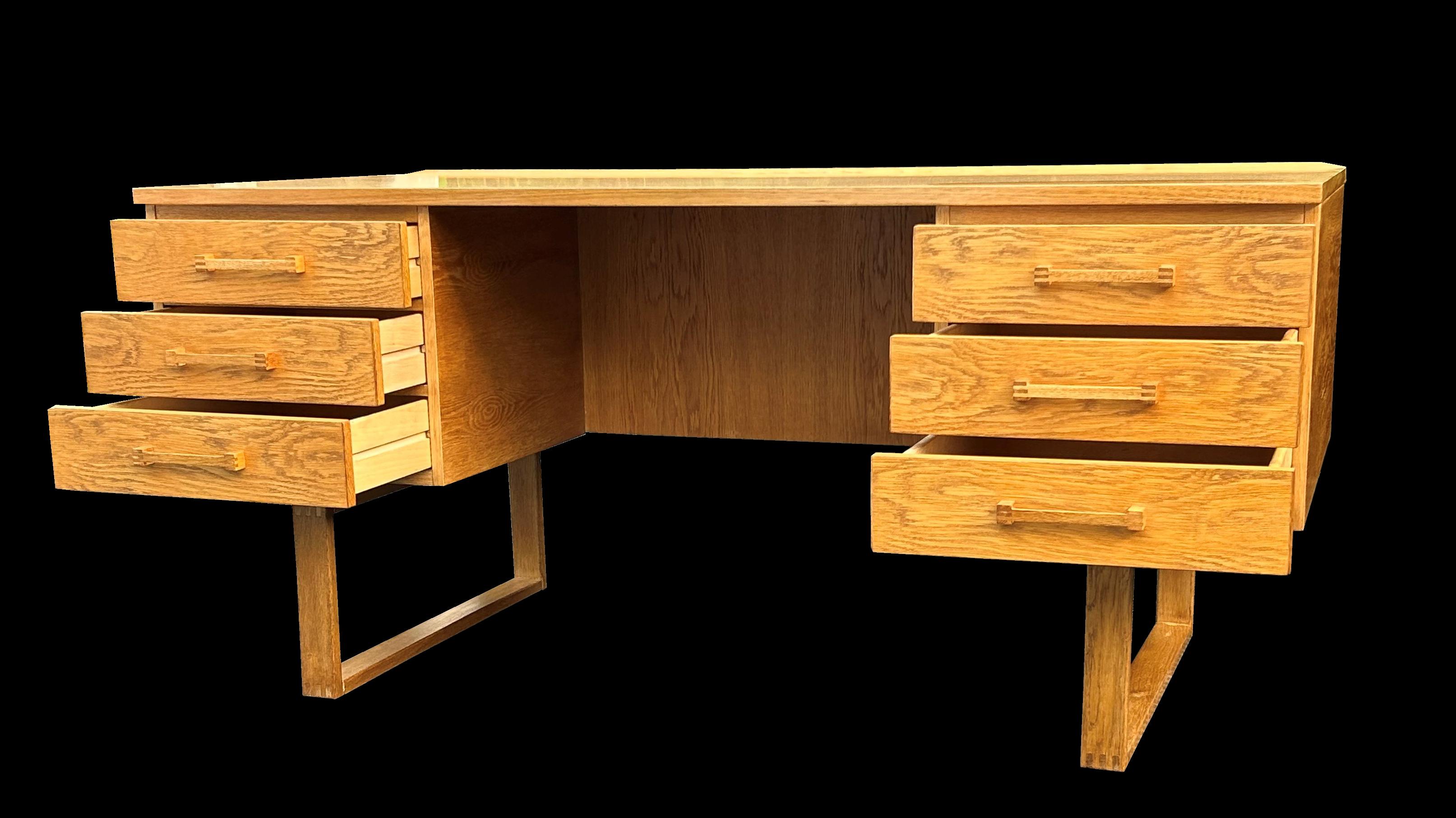 A very nice example of this very popular midcentury desk, this one unusually in Oak, perfect for any home or work office in the Scandinavian Modern style.