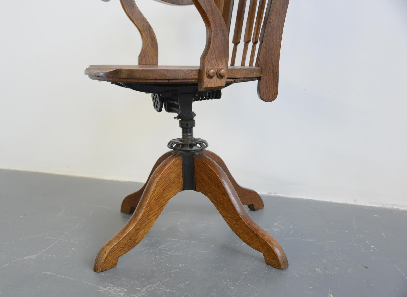 Oak desk chair, circa 1910

- Height adjustable
- Swivels
- Sprung seat
- Belgian, 1910
- 57cm wide x 48cm deep x 98cm tall
- 51cm from floor to seat

Condition report:

Fully functioning, waxed and polished.