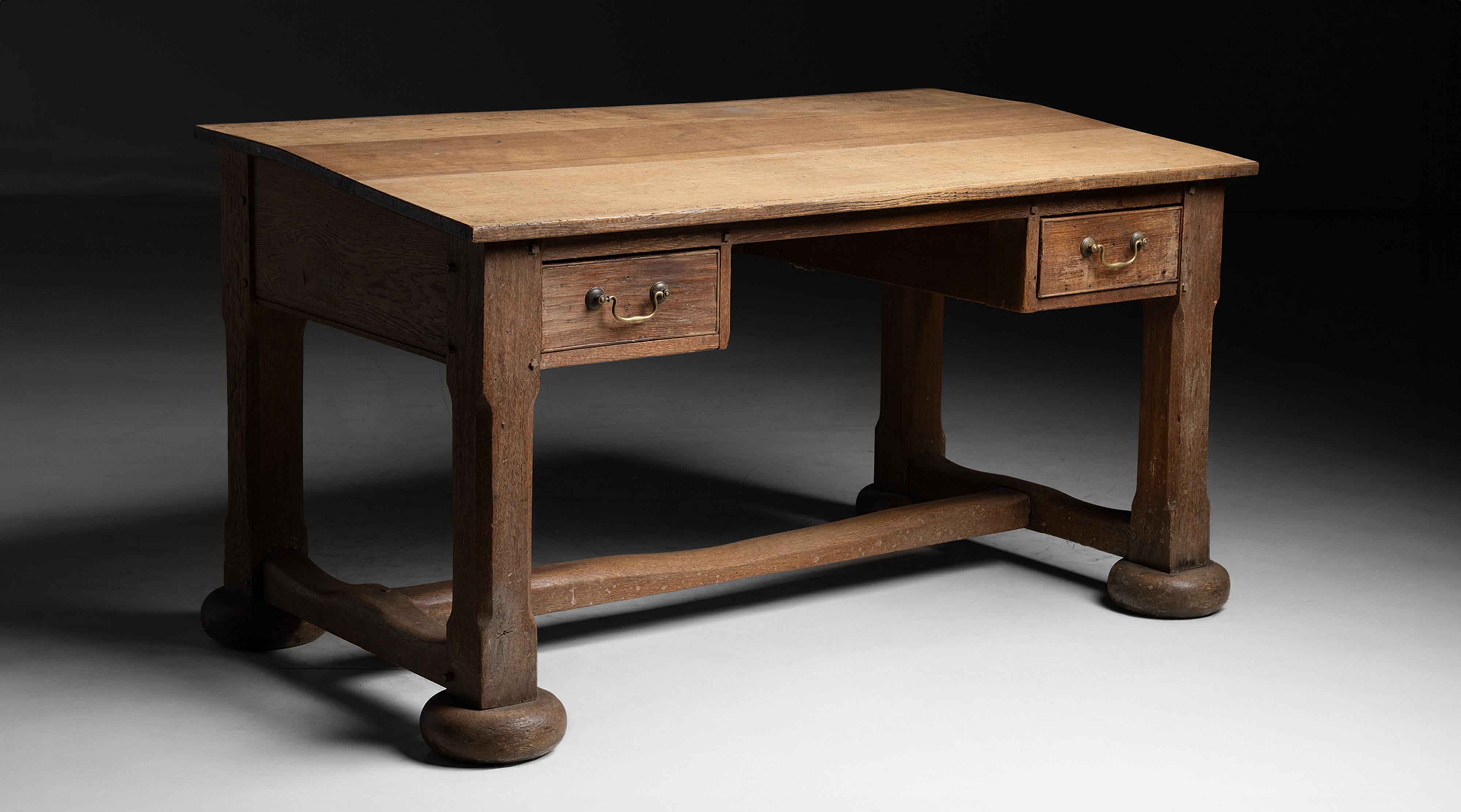 Oak Desk
England circa 1820
Estate made desk with two front drawers, stretcher, and angled surface.
58.75”L x 32.75”d x 32”h