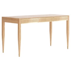 Oak desk with three drawers with brass fronts in mid century modern style