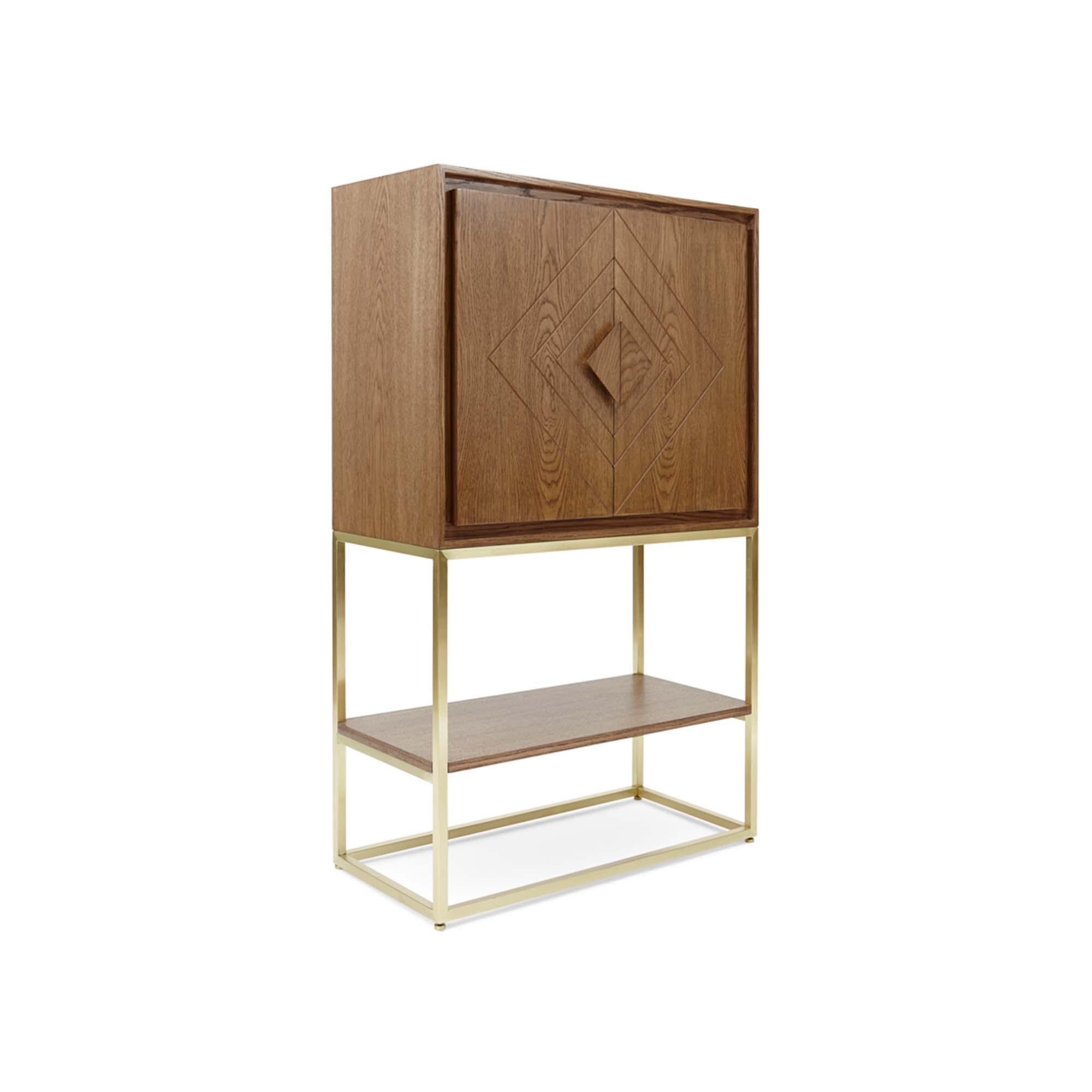 The Diamond Bar rests upon an open metal base with one shelf below and features a scribed geometric pattern on its doors. The interior has a bronze mirror back, glassware shelf with a small drawer, and a removable bronzed mirrored tray. 

The