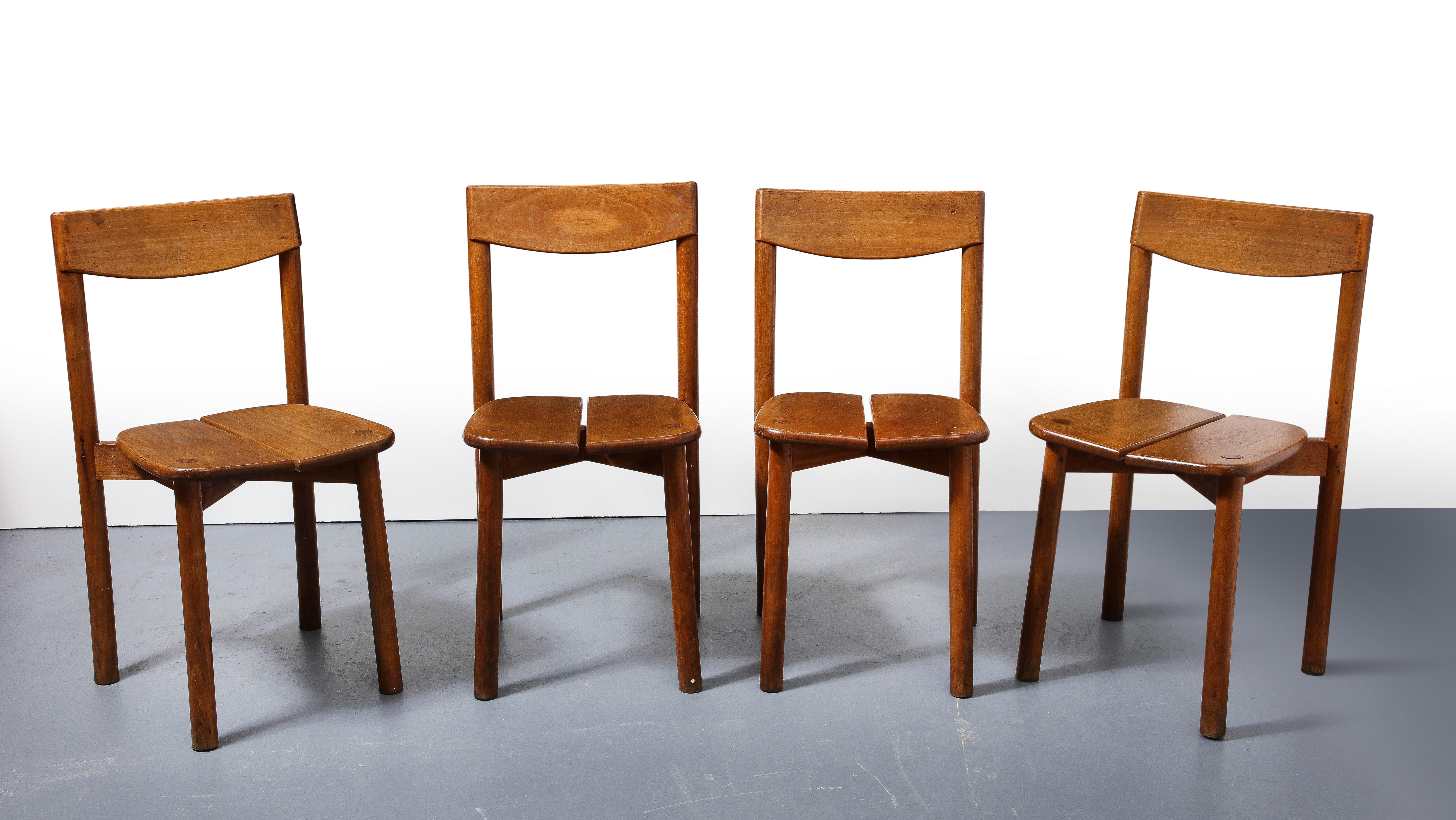 Oak dining chairs by Pierre Gautier-Delaye, France, circa 1950s

Simple, smart dining chairs by acclaimed furniture designer Pierre Gautier-Delaye. Constructed out of solid oak, these chairs consist of tubular legs, a slatted seat, crossbar