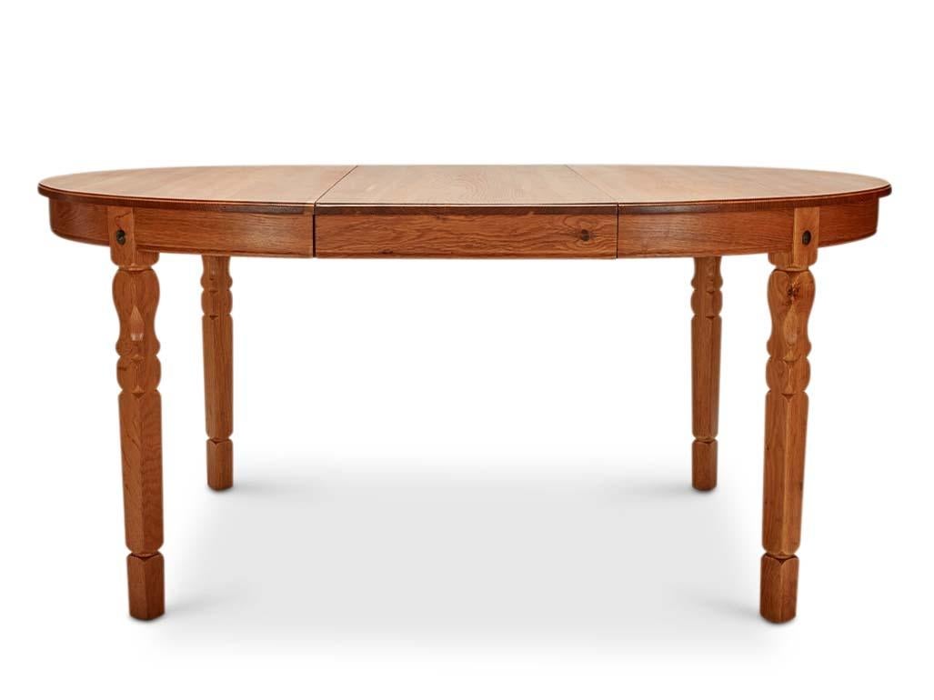 HENNING KJAERNULF OAK DINING TABLE
Denmark c. 1960’s
With (1) inset leaf. 
Table Dimensions: 46