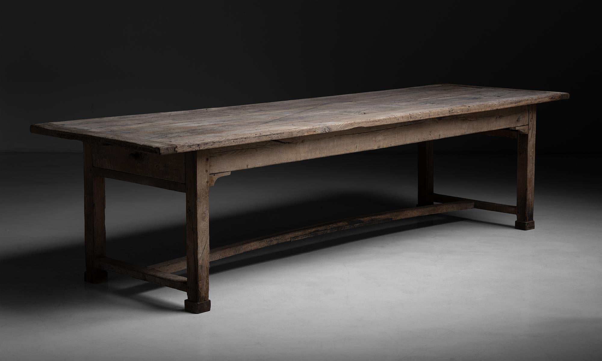 Oak Dining Table, France circa 1890

Solid oak construction, plank top with false drawers.

Measures 119”L x 36.5”d x 30.25”h.