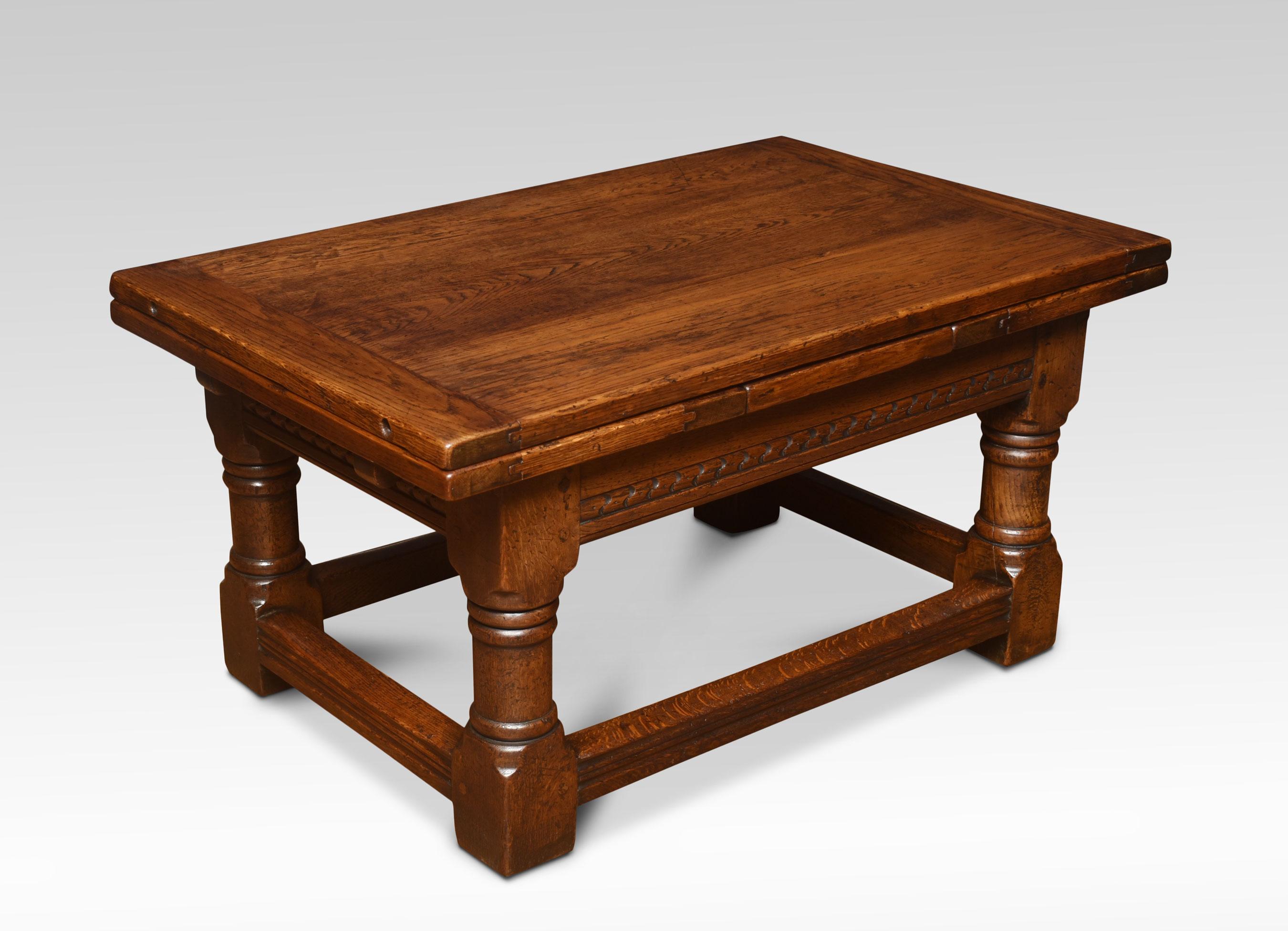 Oak draw leaf coffee table, the rectangular solid oak top above two pull-out ends, Raised up on turned legs united by stretchers.
Dimensions
Height 21.5 inches
Width 42 inches when leaves are open 72 inches
Depth 26.5 inches.