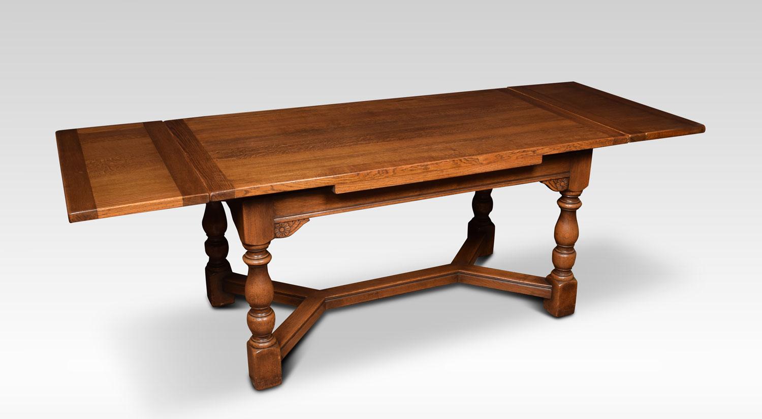 Oak draw leaf refectory table, the rectangular solid oak top above two pull out ends, raided up on turned tapering legs joined by a double Y-shaped stretcher.
Dimensions:
Height 30 inches
Length 60 inches when open 90 inches
Width 33 inches.