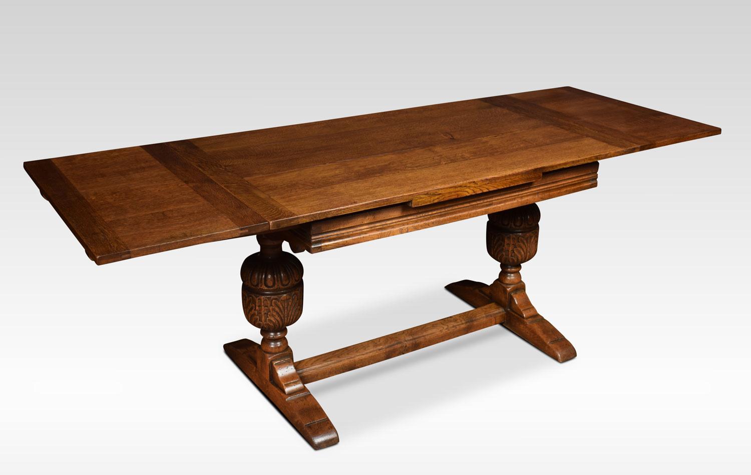 Oak draw leaf refectory table, the rectangular solid oak top having pullout / pull-out ends. Above lobed and leaf carved cup and cover supports united by a stretcher.
Dimensions:
Height 29.5 inches
Length 51 inches when open 84 inches
Width 30.5