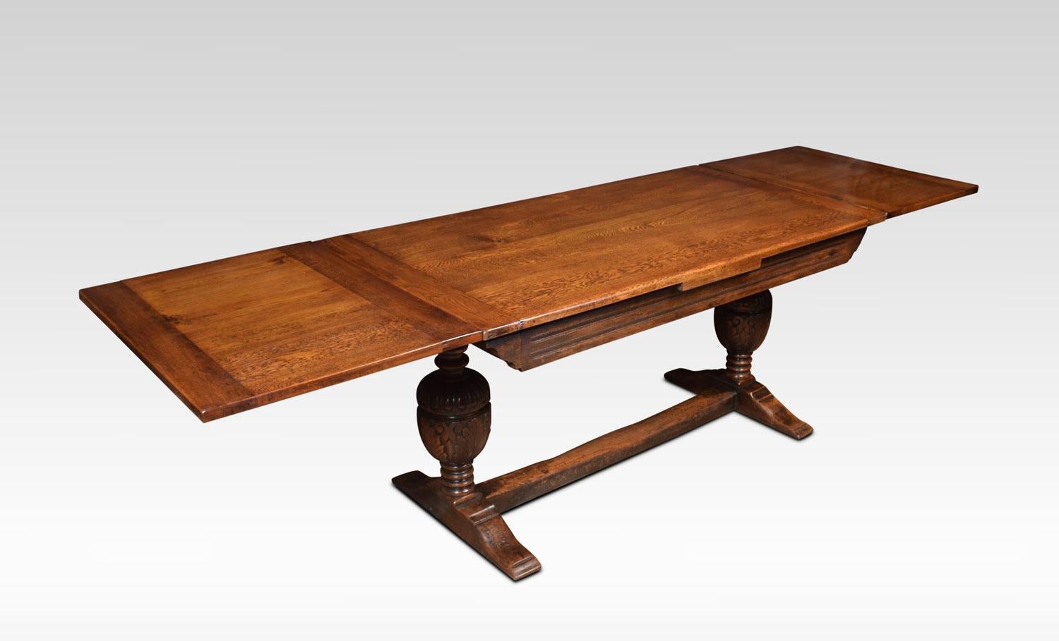 Oak draw leaf refectory table, the rectangular solid oak top having pullout / pull-out ends. Above carved bulbous cup and cover supports united by a stretcher.
Dimensions:
Height 30 inches
Width 60 inches when open 107.5 inches
Depth 31.5 inches.