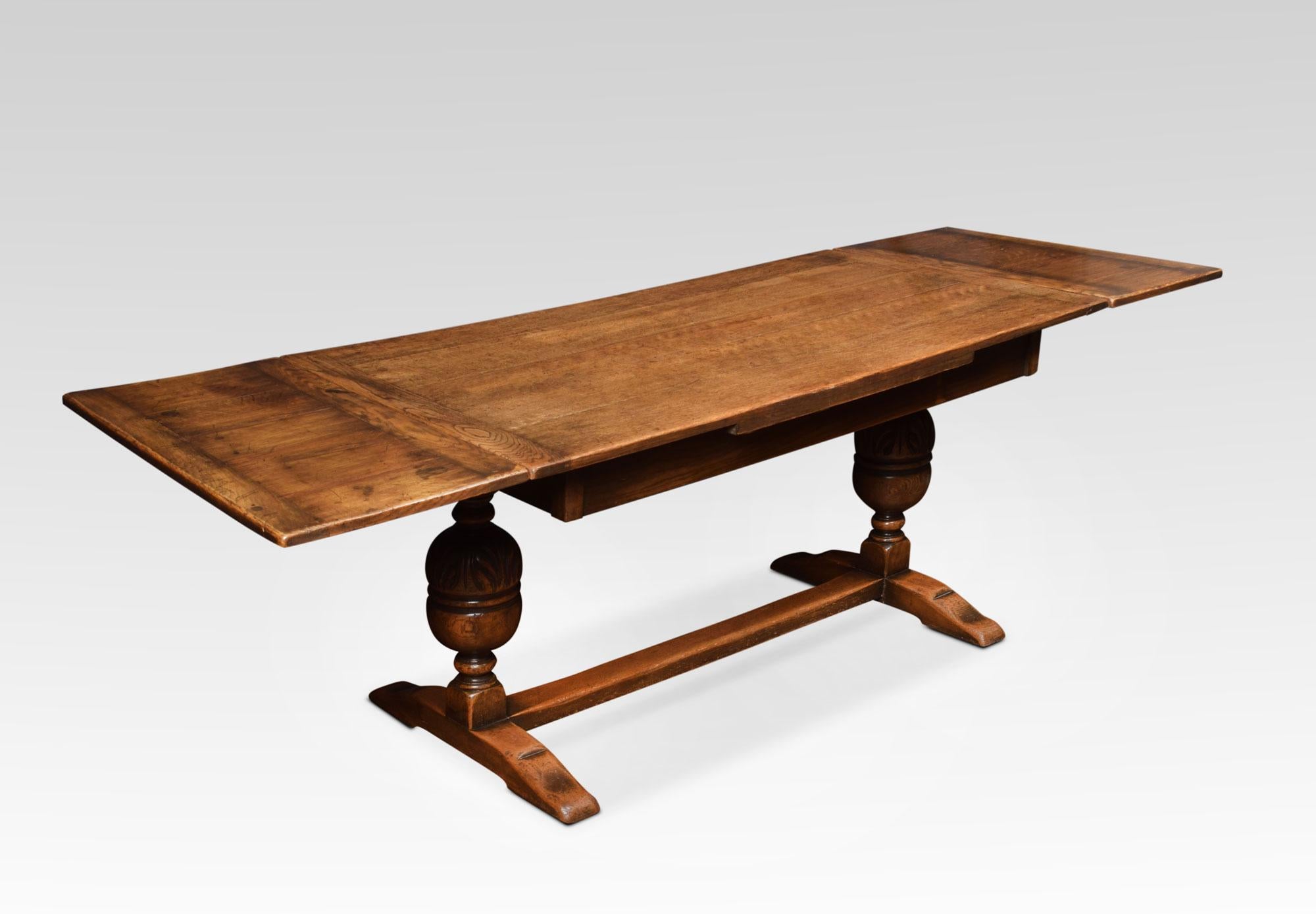 Oak draw leaf refectory table, the rectangular solid oak top having pullout / pull-out ends. Above carved bulbous cup and cover supports united by a stretcher.
Measures: Height 29.5 inches
Width 57 inches when open 90.5 inches
Depth 31.5 inches.