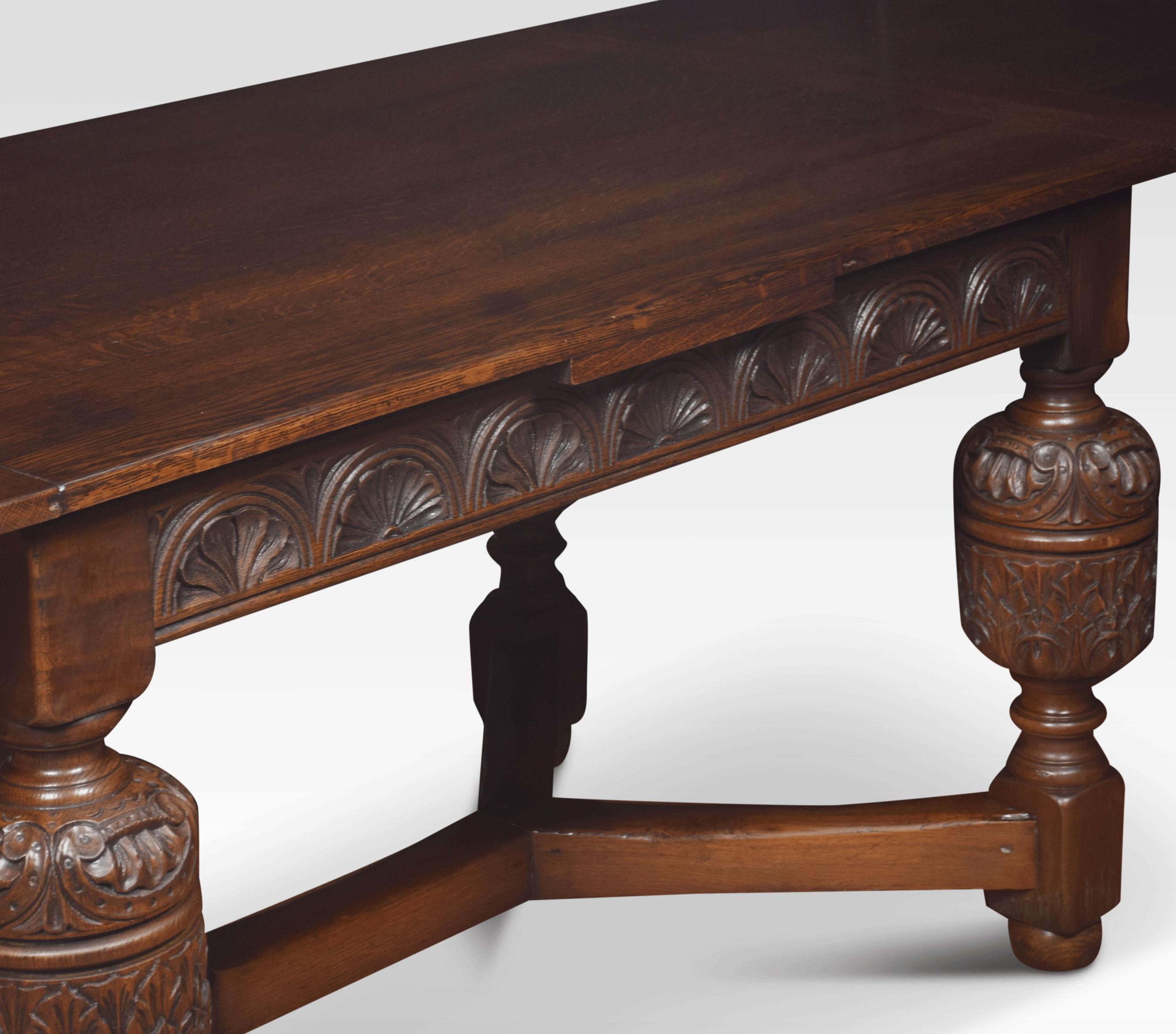 Oak draw-leaf table the plank top having pull-out leaves to each end above a carved frieze raised on bulbous cup and cover legs leading down to bun feet united by stretchers.
Dimensions:
Height 31 inches
Width 54 inches when open 96 inches
Depth