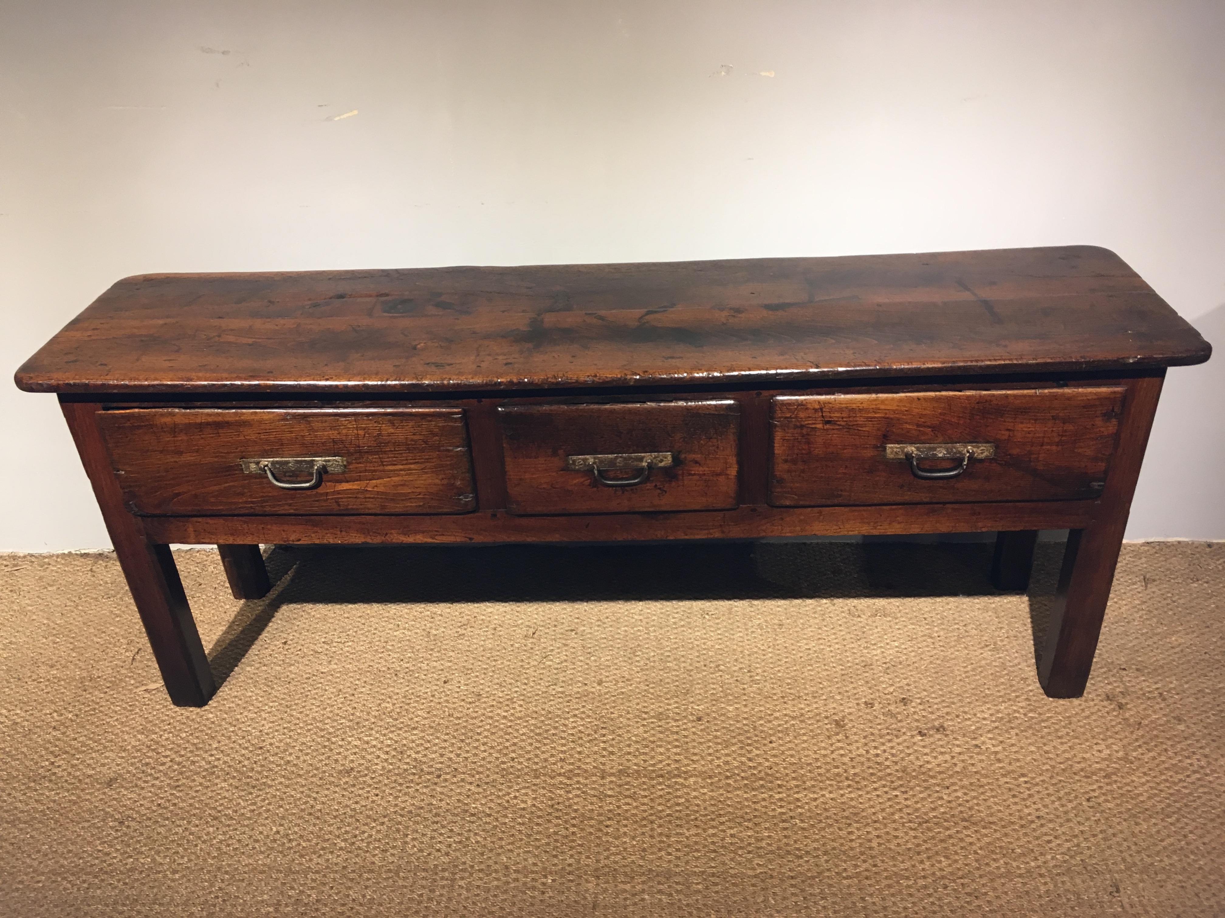 Great early 19th century oak dresser base, circa 1820.
Three large drawers with original iron handles, you can see how many times these have been lifted and dropped back down. 

This piece has been through our workshops cleaned/ polished great