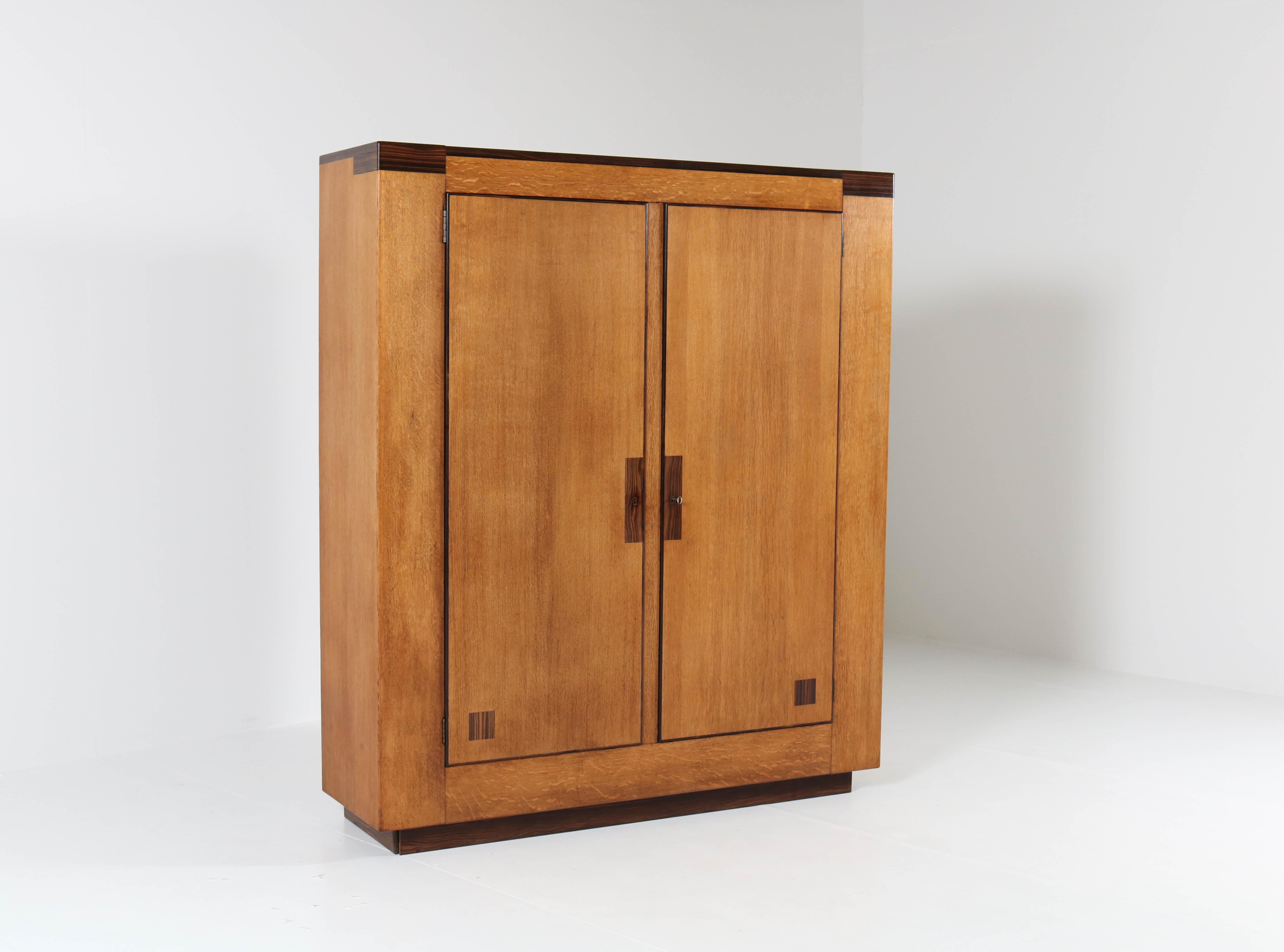 Offered by Amsterdam Modernism:
Magnificent and very rare Art Deco Haagse School armoir or wardrobe.
Design by Anton Lucas Leiden.
Striking Dutch design from the twenties.
Oak with ebony Macassar.
This stunning piece can be dismantled for easy