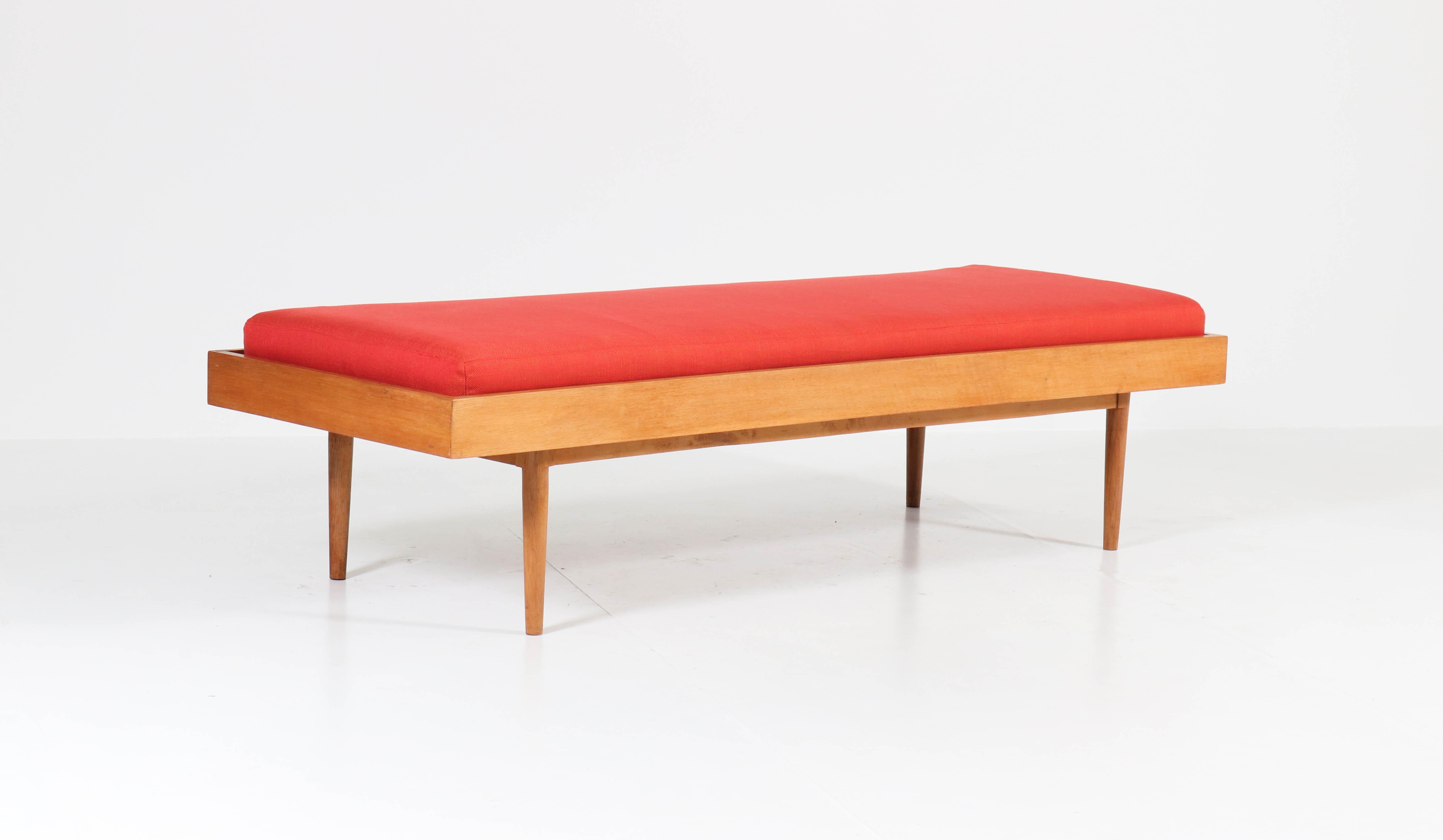 Funky Mid-Century Modern daybed.
Striking Dutch design from the 1960s.
Solid oak and beech and re-upholstered with quality Italian fabric.
In good original condition with minor wear consistent with age and use,
preserving a beautiful patina.

 