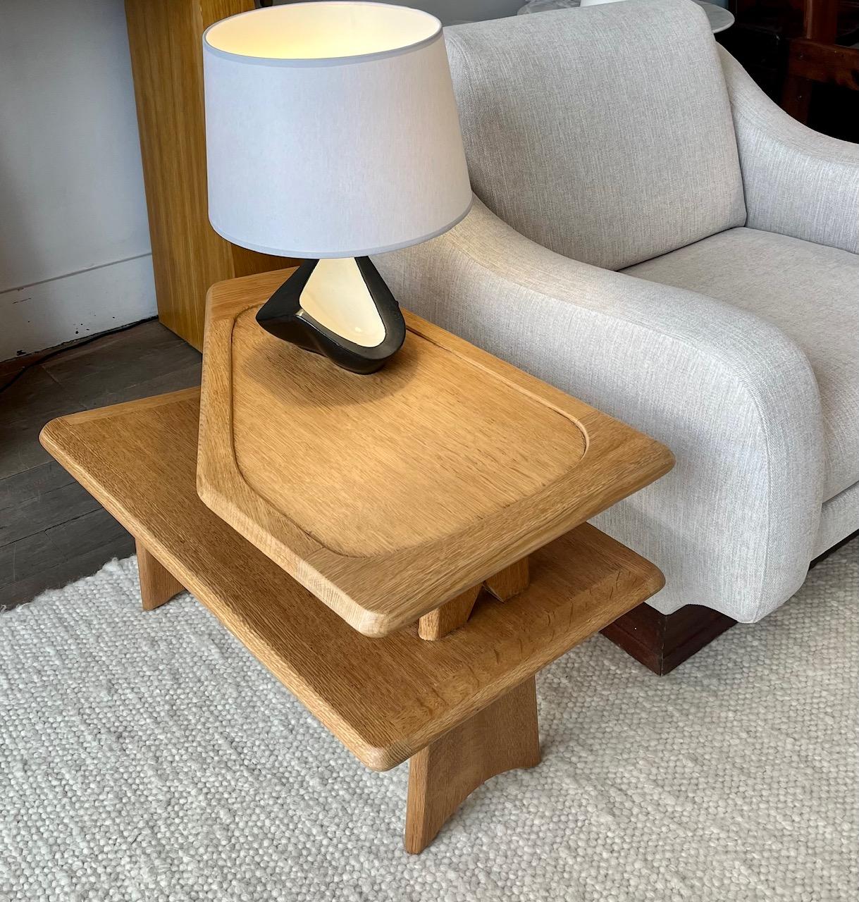 Rare oak end table by Guillerme et Chambron for Votre Maison.
Two tiers resting on wide feet 
Unusual asymmetrical design.
 this light oak piece can serve as an end table or a cocktail table 

France circa 1960 

Dimensions 
L 77 cm ( 30.3