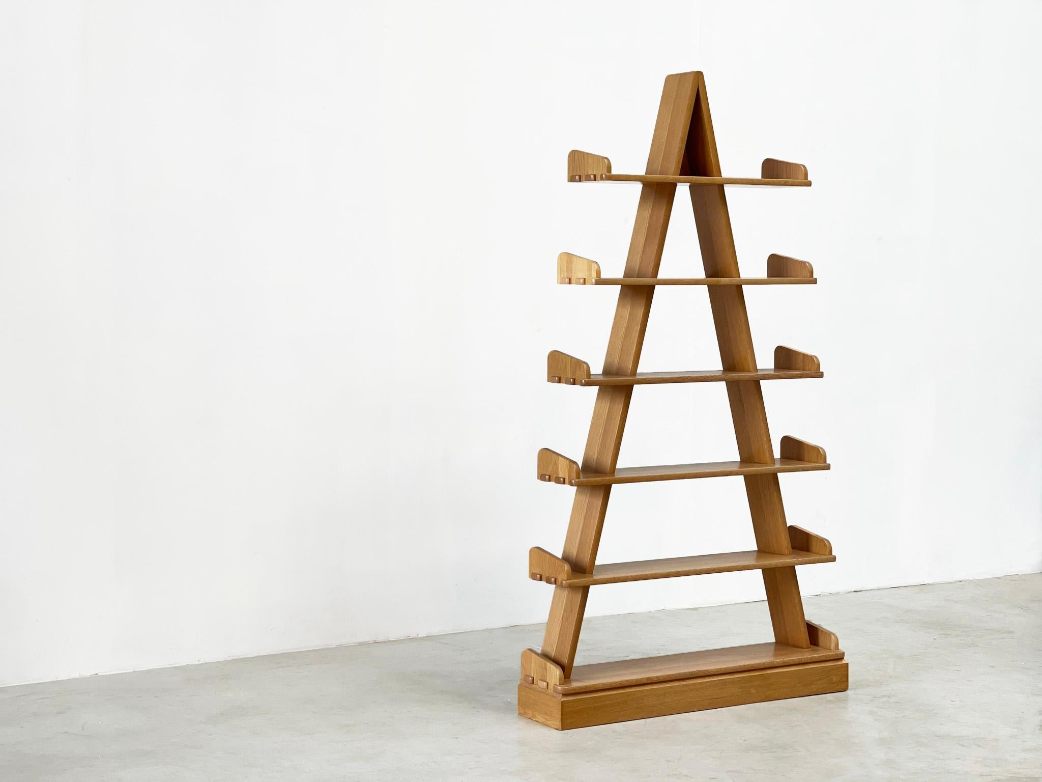 a solid oak etagere from France from the 80s.

This etagere has a very elagant abd rustic feel and look. It is a perfect rack that can be placed in a modern interior. The rack can be used as a etagere but also as a roomdevider. He remains firmly on