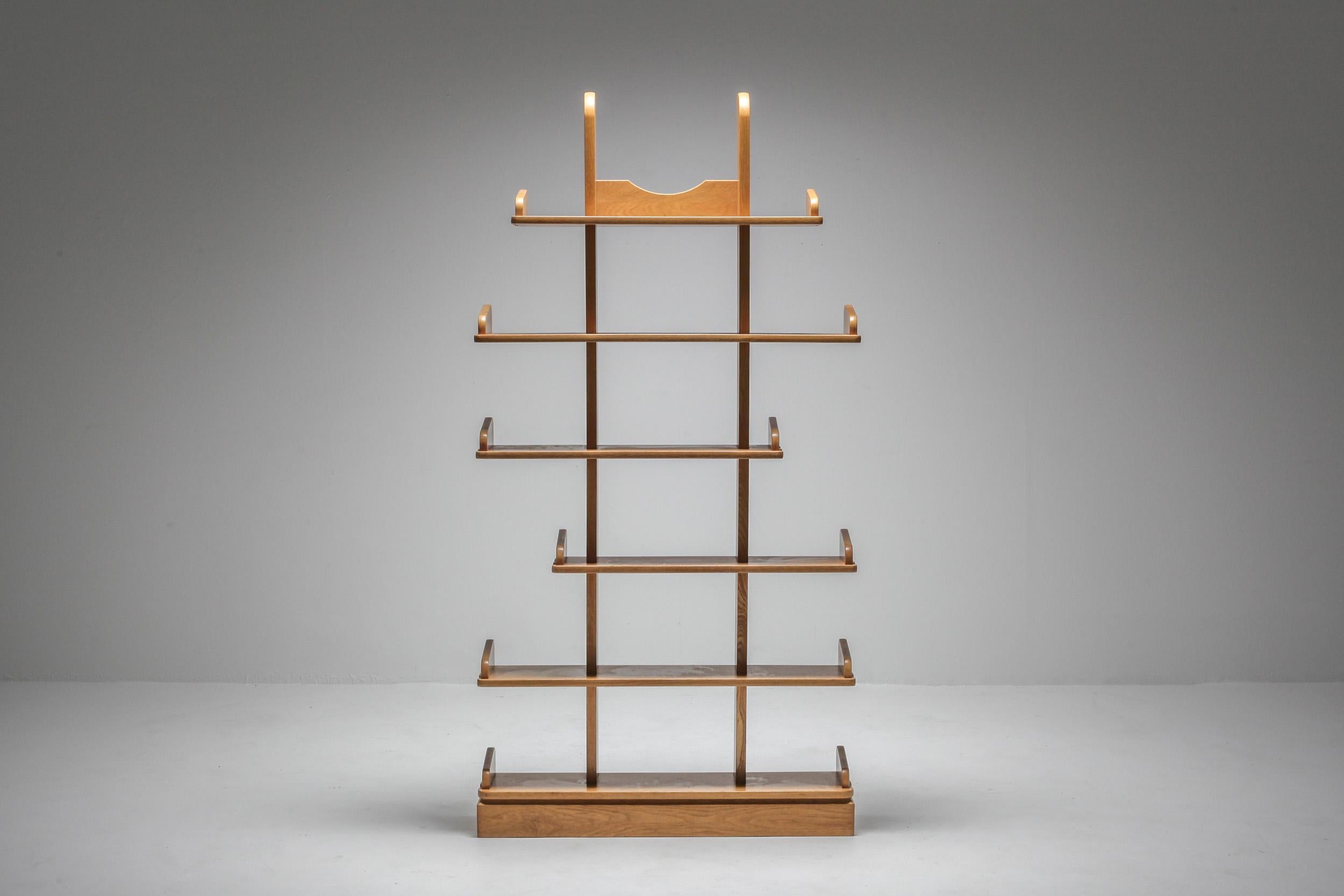 Dutch studio craft shelving from the 1970s

Free standing pair of display units which can serve as room dividers.
Solid oak pieces which have a modern and organic feel to it.

 
