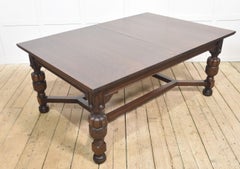 Oak extending dining table by Maple and Co