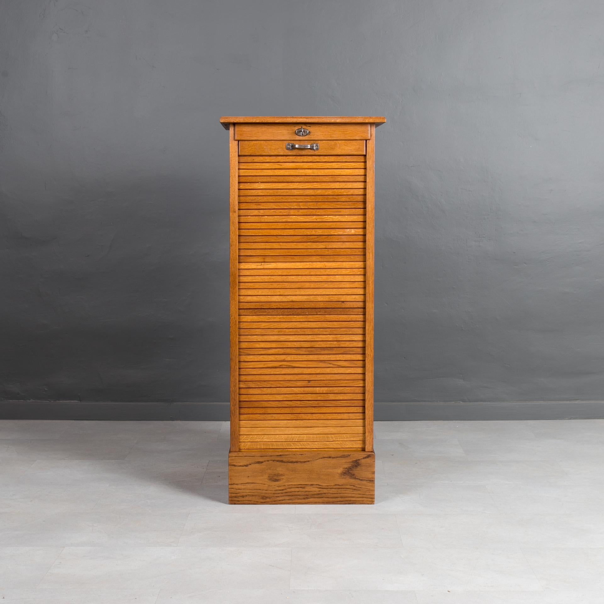 This file cabinet was made around 1920s. It is made of solid oak and was carefully renovated. The surface was cleaned and refinished with wood oil that not only preserves and nourishes the wood but also provides very natural finishing touch. It