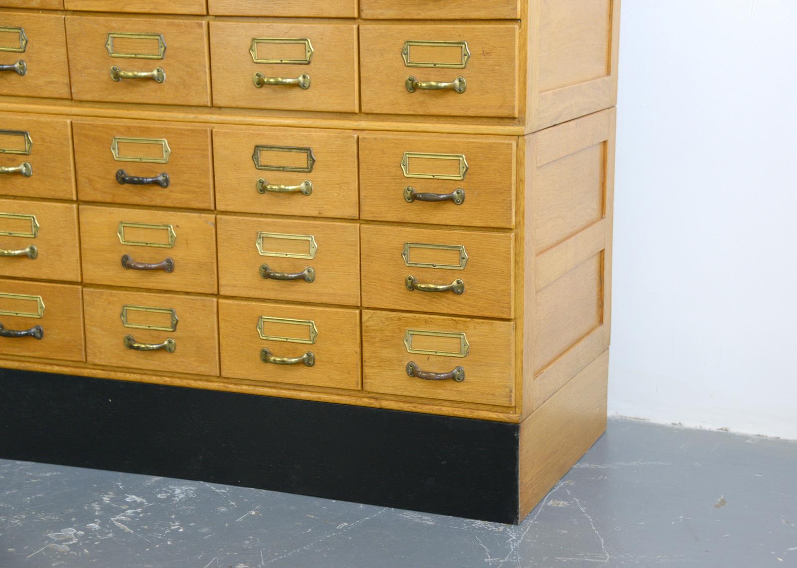 Oak filing drawers, circa 1950s

- Light oak drawers and frame
- Steel handles and card holders
- Ply drawer bottoms
- German, 1950s
- Measures: 94cm wide x 147cm x 42cm 

Condition report

Fully restored with minimal cosmetic wear.