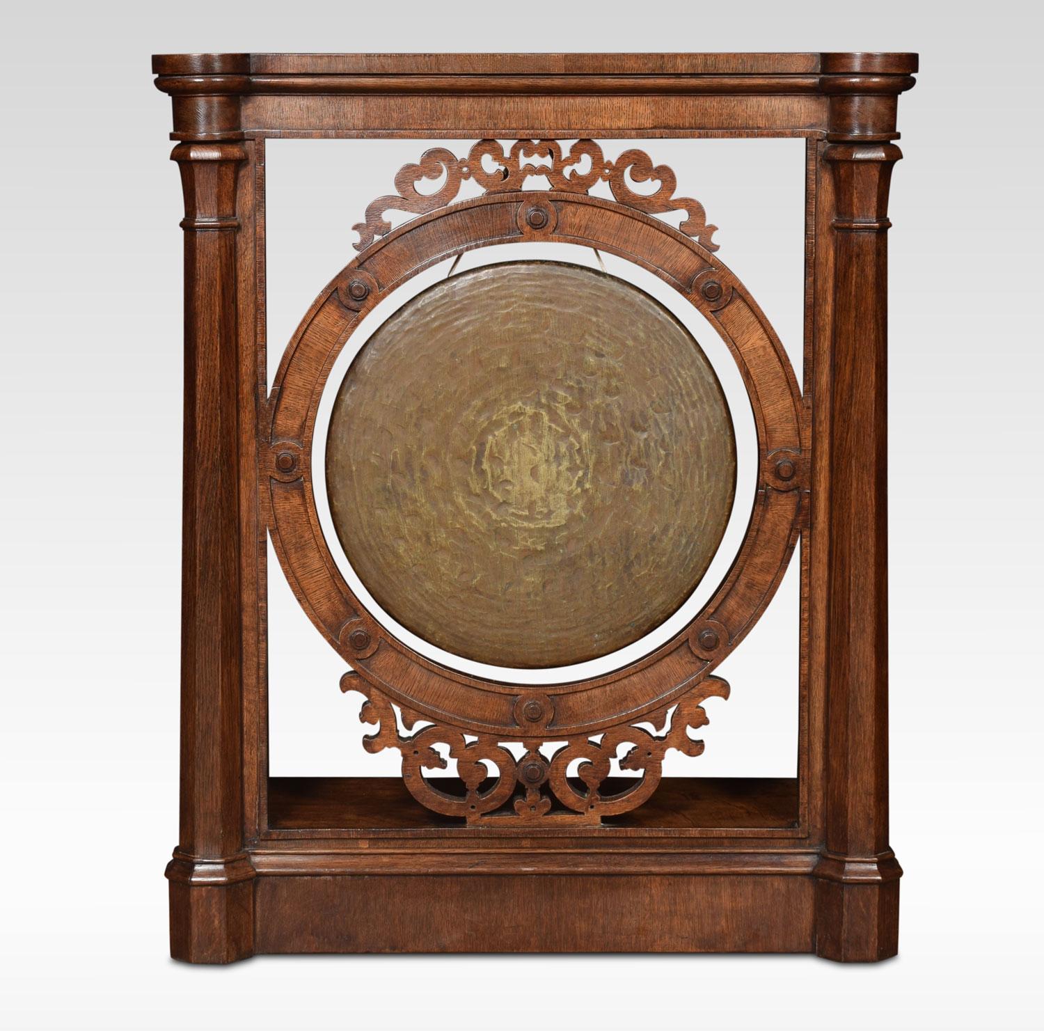 Dinner gong of Gothic design the oak frame with fretwork panels and octagonal column pilasters surrounding the original gong.
Dimensions:
Height 35.5 inches
Length 29.5 inches
Width 12.5 inches.